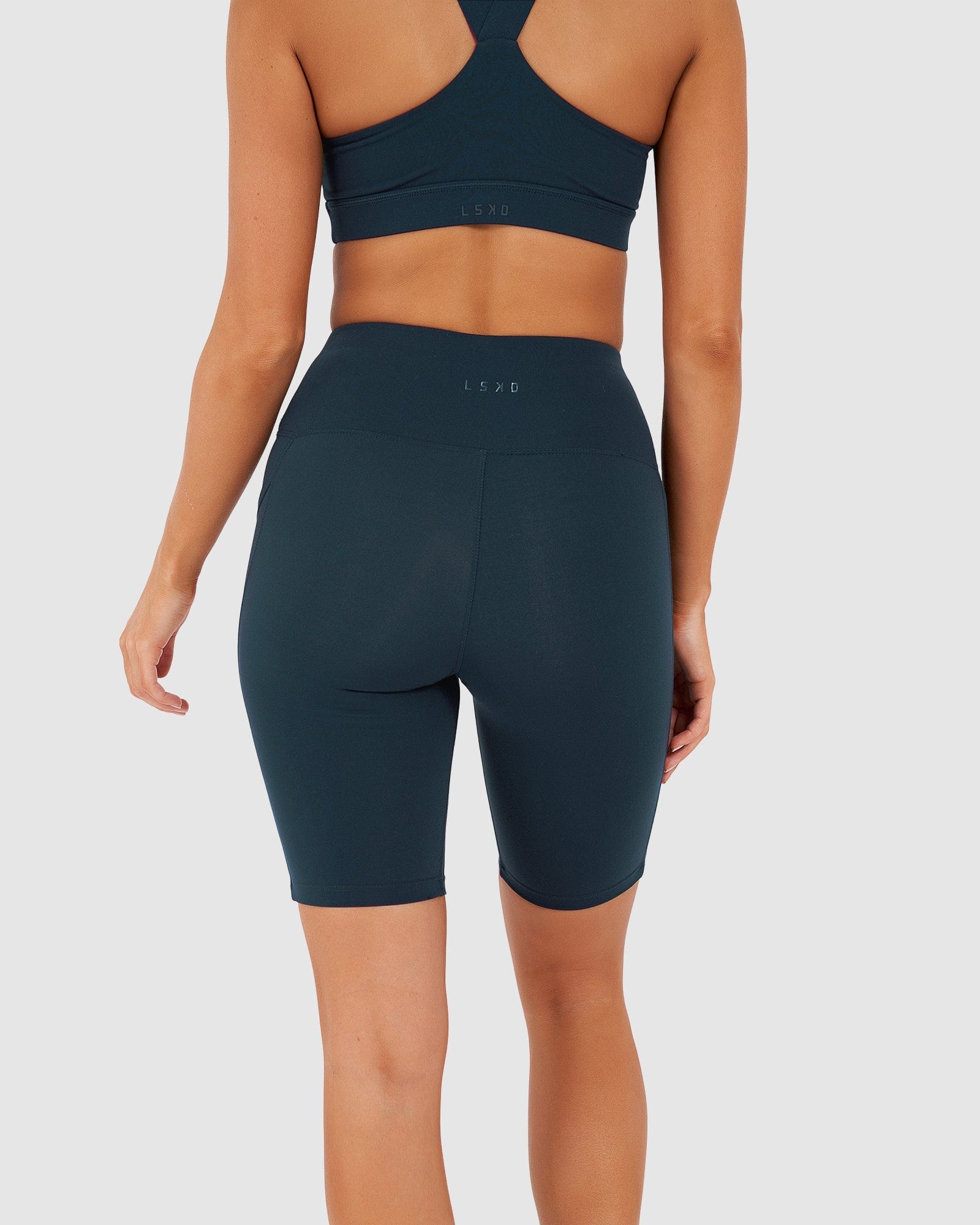 Model wearing Rep Short Tight Small Logo - Deep Teal