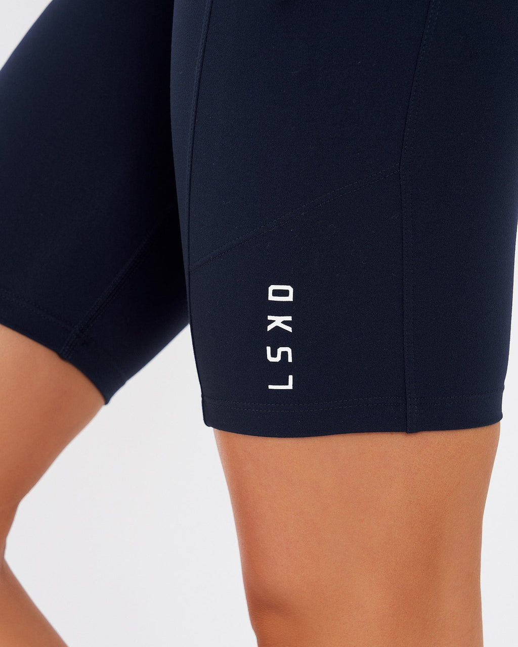 Model wearing Rep Short Tight Small Logo - Navy
