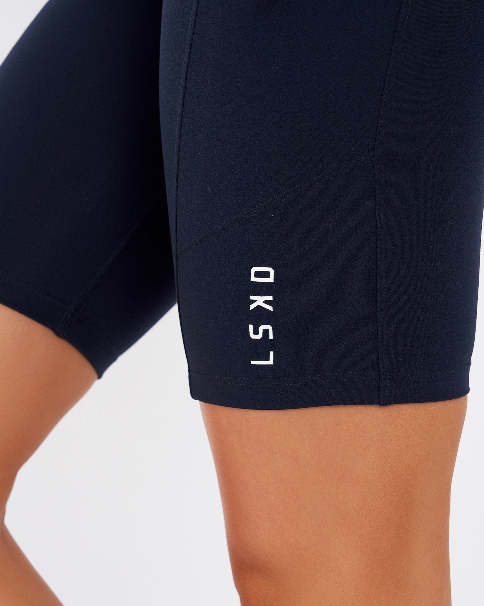 Model wearing Rep Short Tight Small Logo - Navy