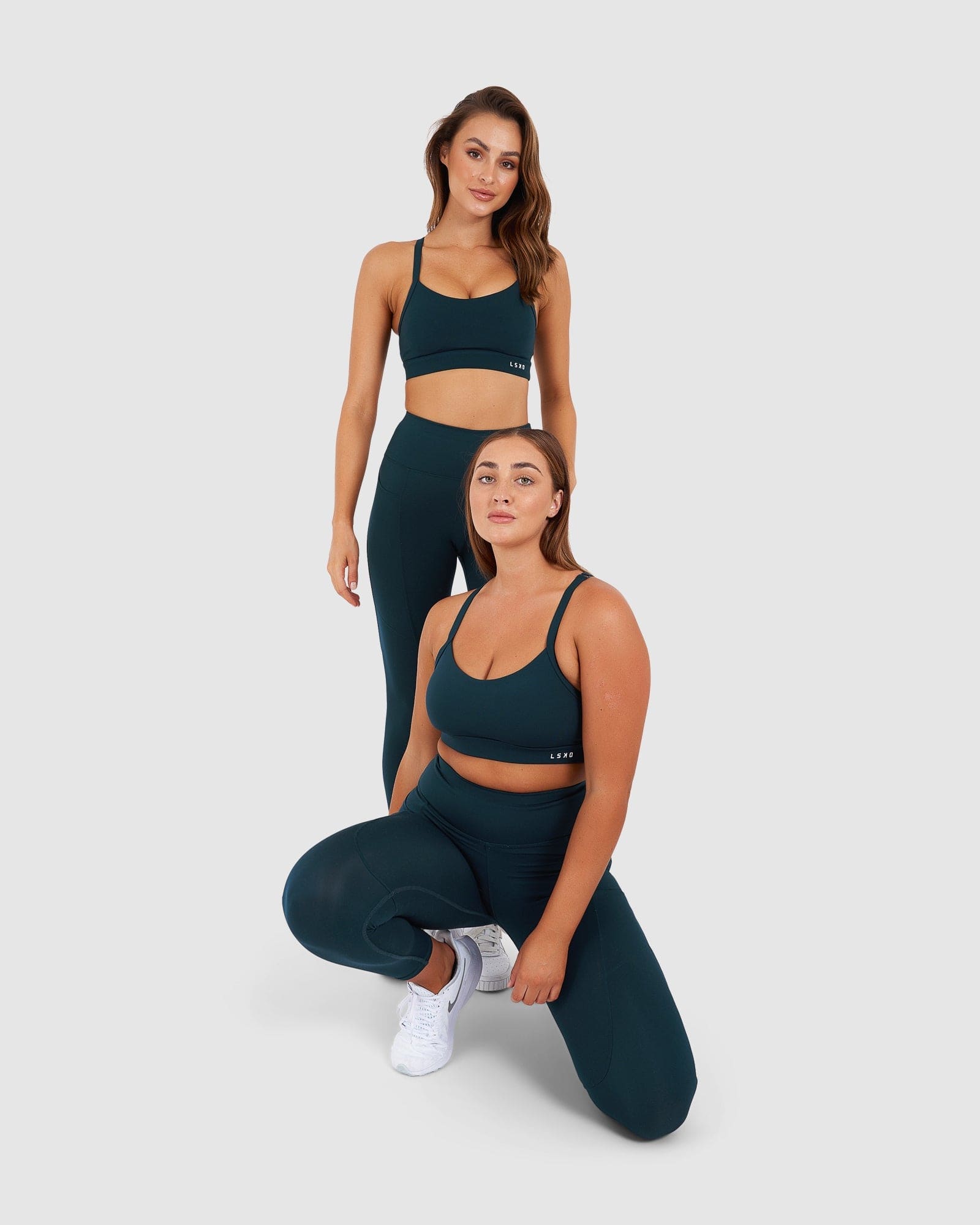Model wearing Momentum Sports Bra - Deep Teal