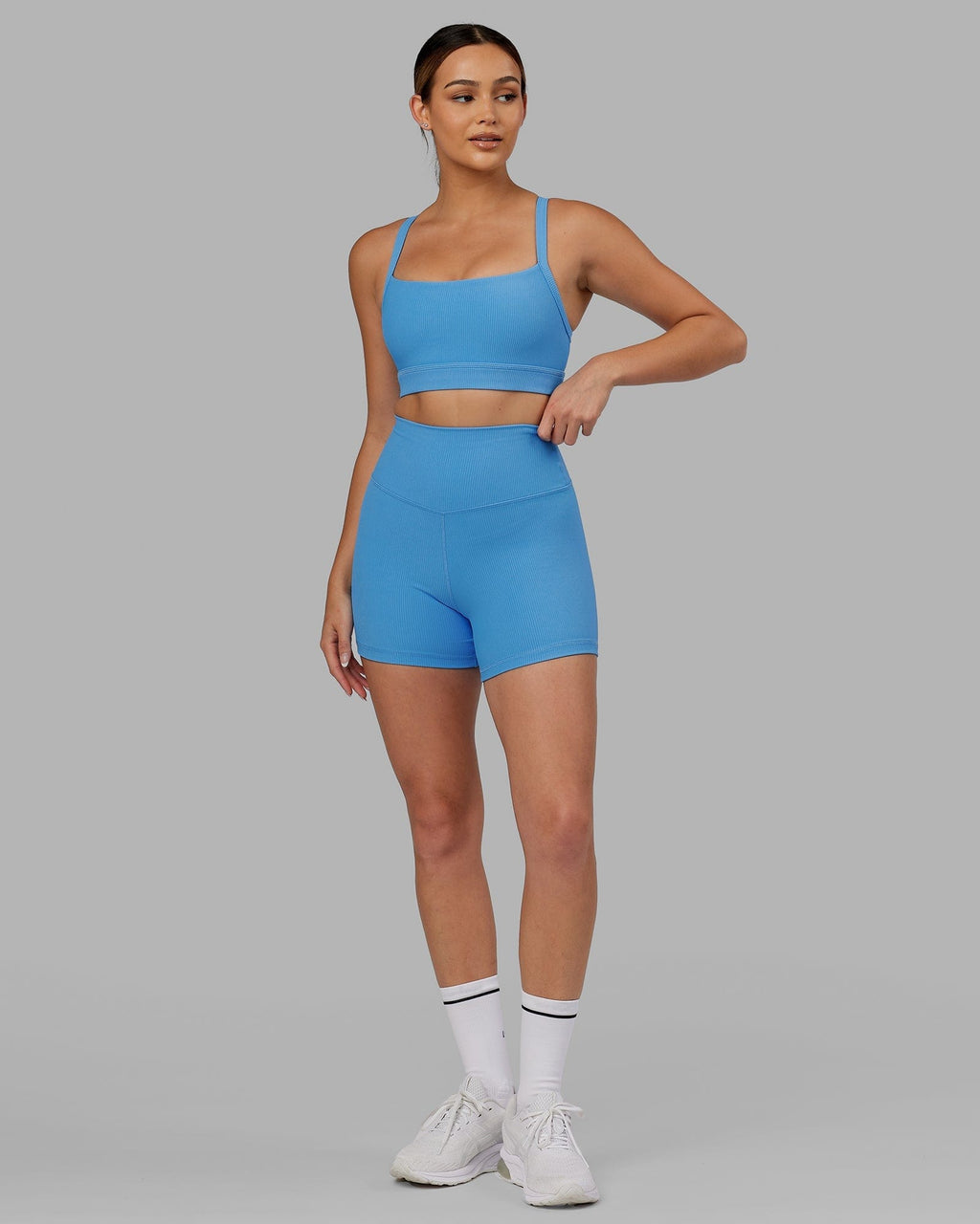 Model wearing Momentum Ribbed Sports Bra - Azure Blue