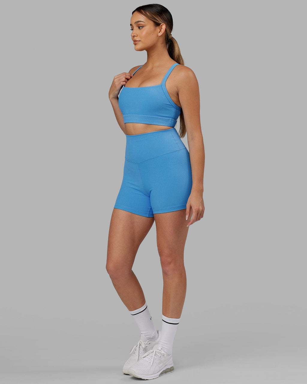 Model wearing Momentum Ribbed Sports Bra - Azure Blue