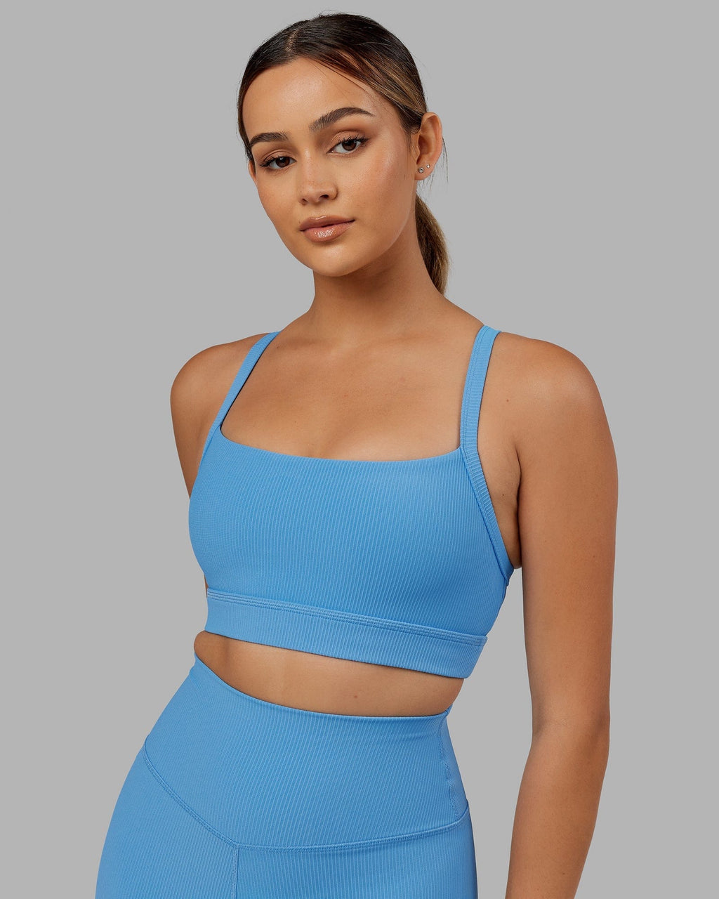 Model wearing Momentum Ribbed Sports Bra - Azure Blue