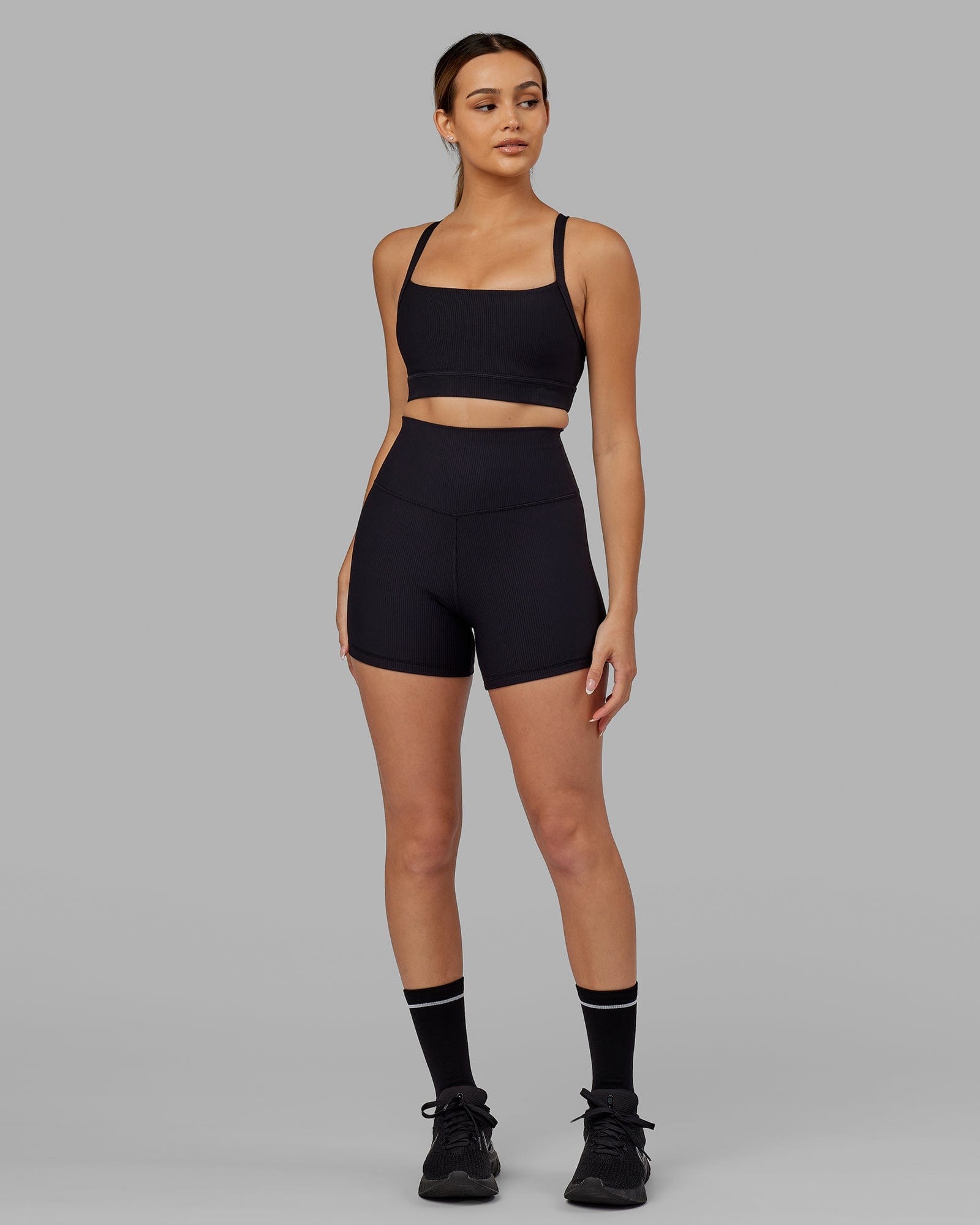 Model wearing Momentum Ribbed Sports Bra - Black