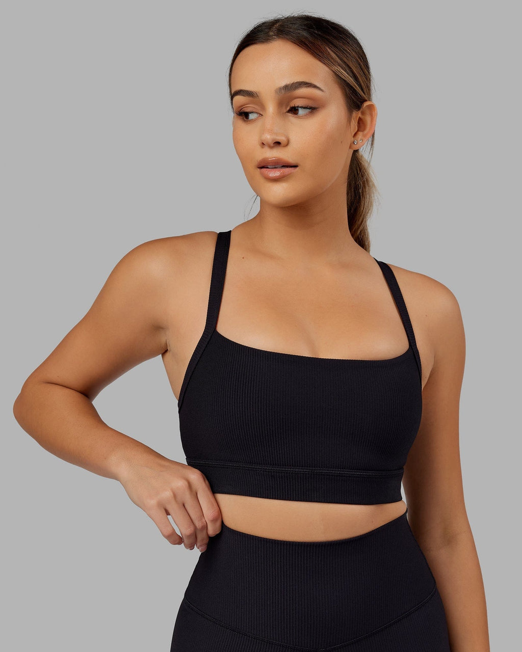 Model wearing Momentum Ribbed Sports Bra - Black