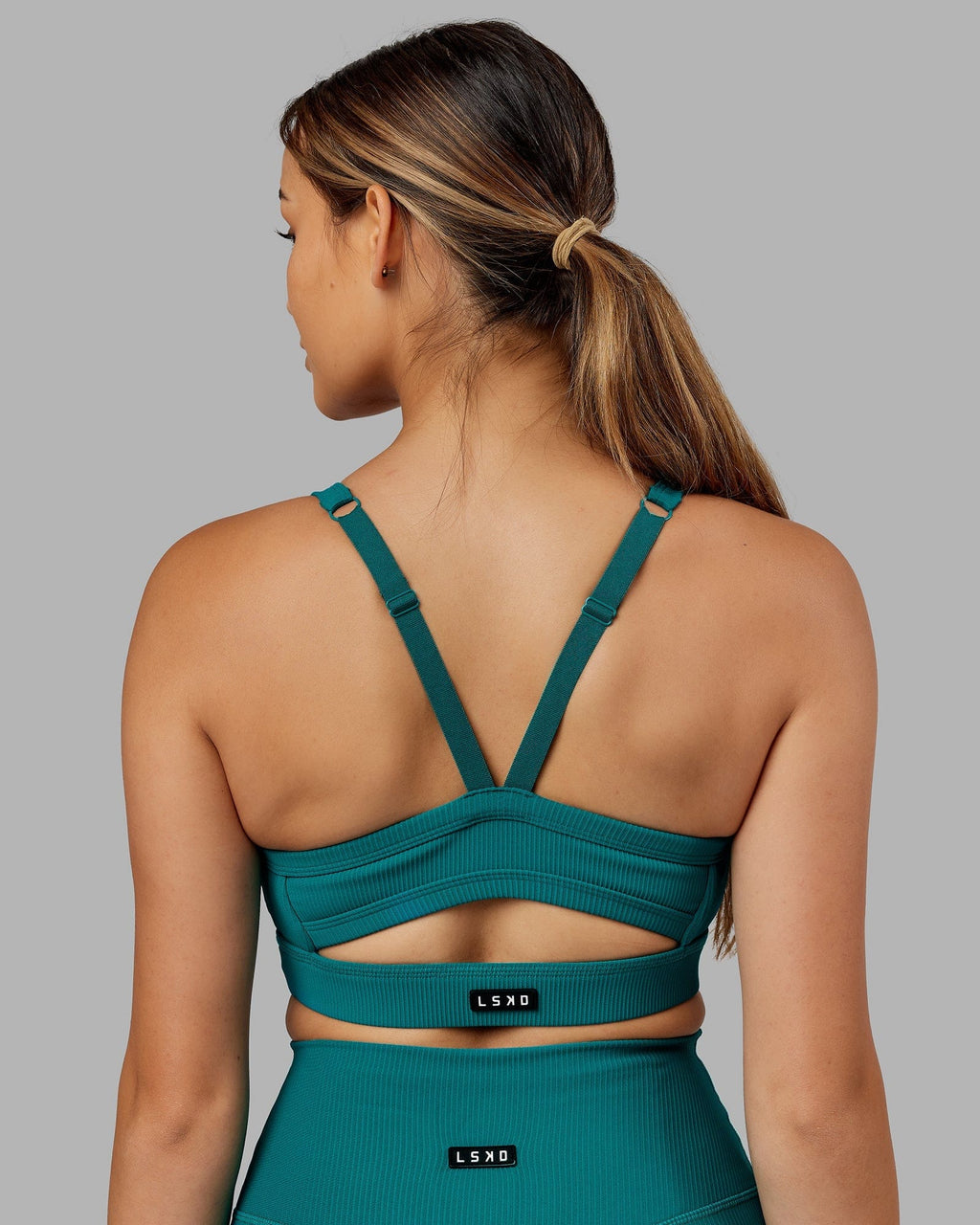 Model wearing Momentum Ribbed Sports Bra - Sea Green