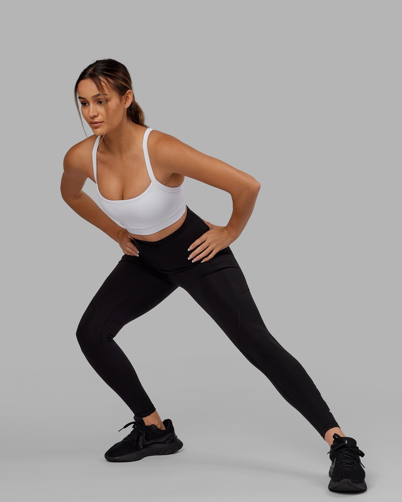 Model wearing Momentum Ribbed Sports Bra - White