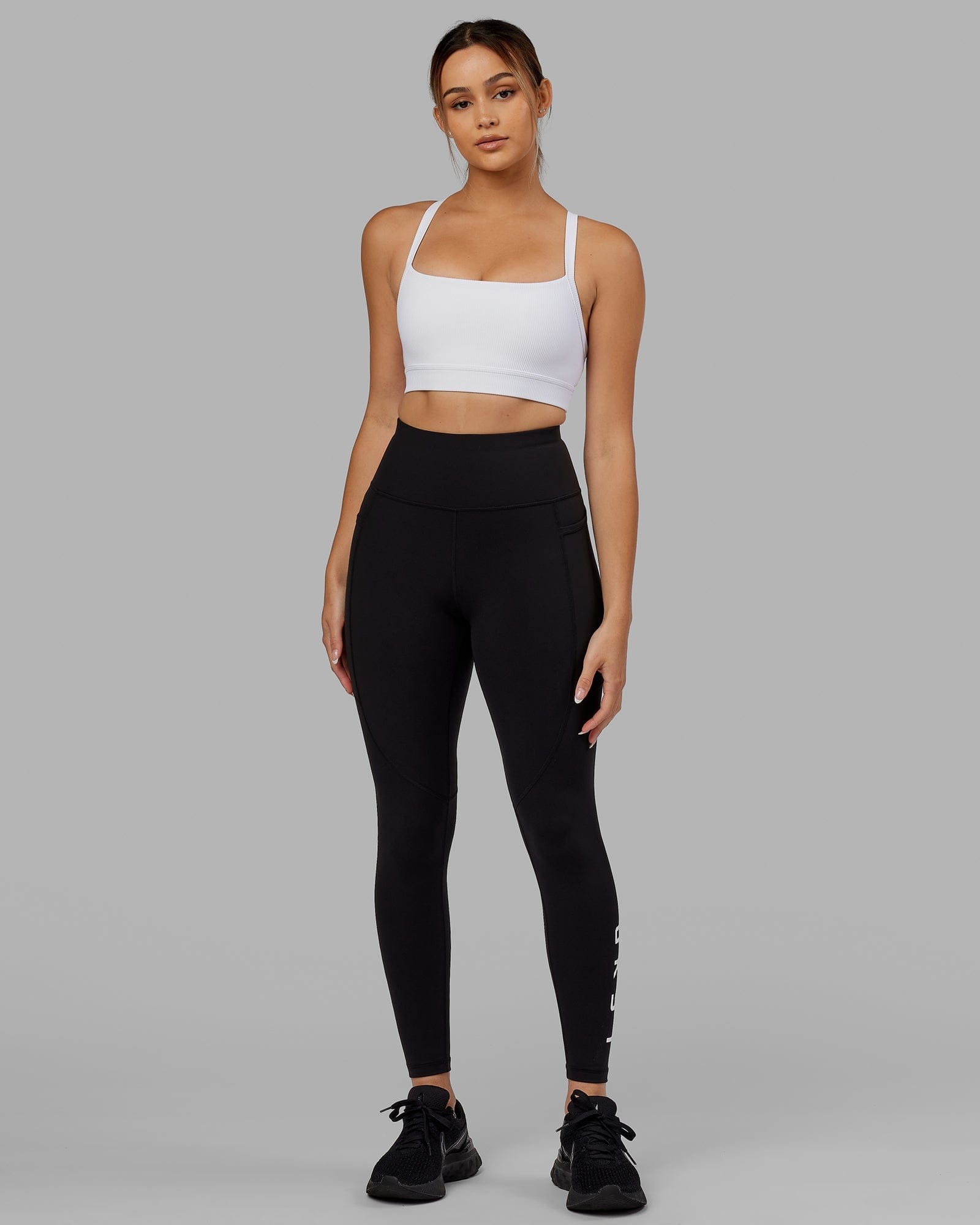 Model wearing Momentum Ribbed Sports Bra - White