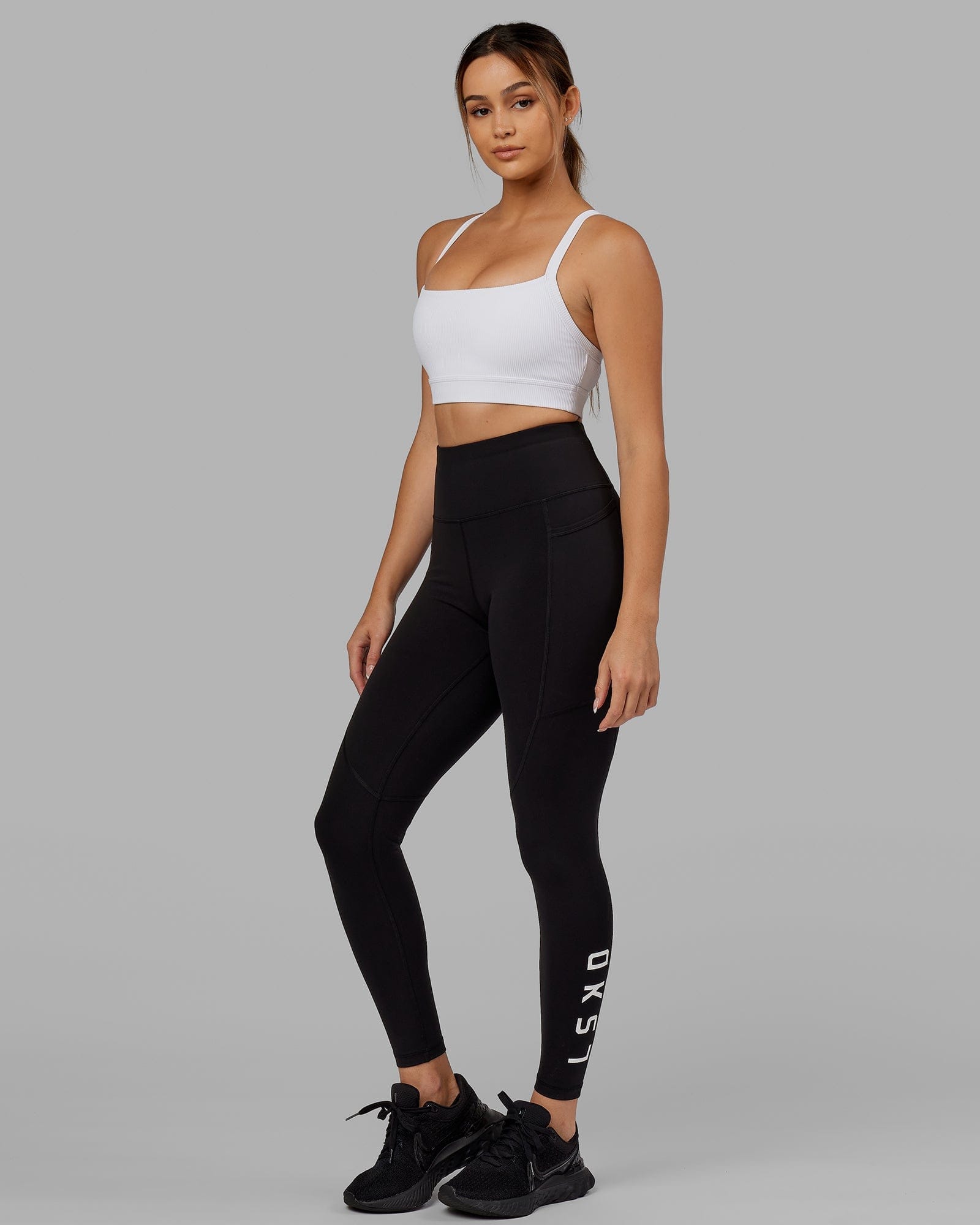 Model wearing Momentum Ribbed Sports Bra - White