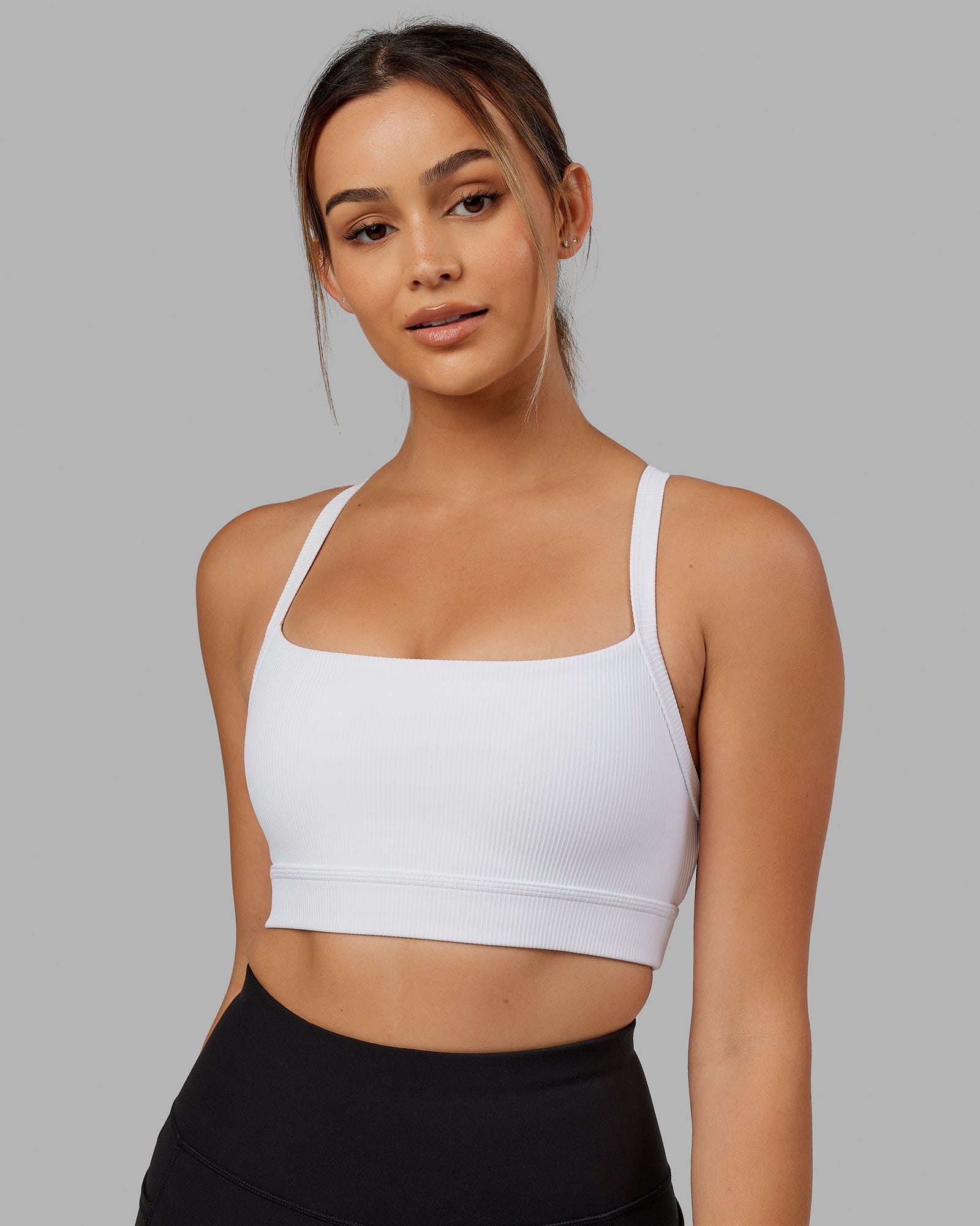 Model wearing Momentum Ribbed Sports Bra - White