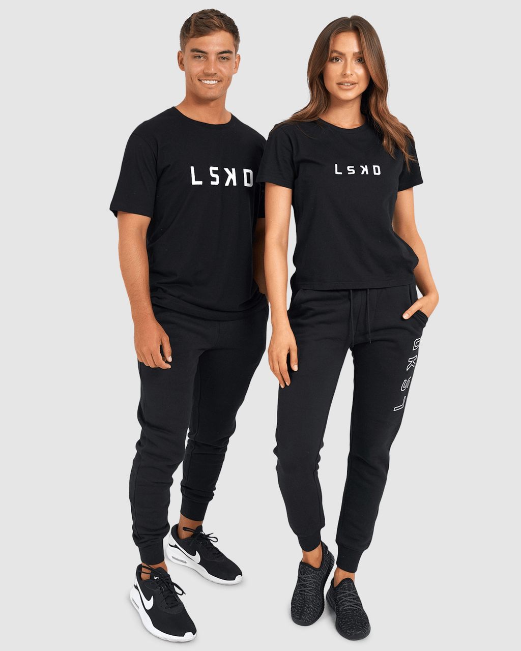 Model wearing Unisex Tidy Trackpant - Black