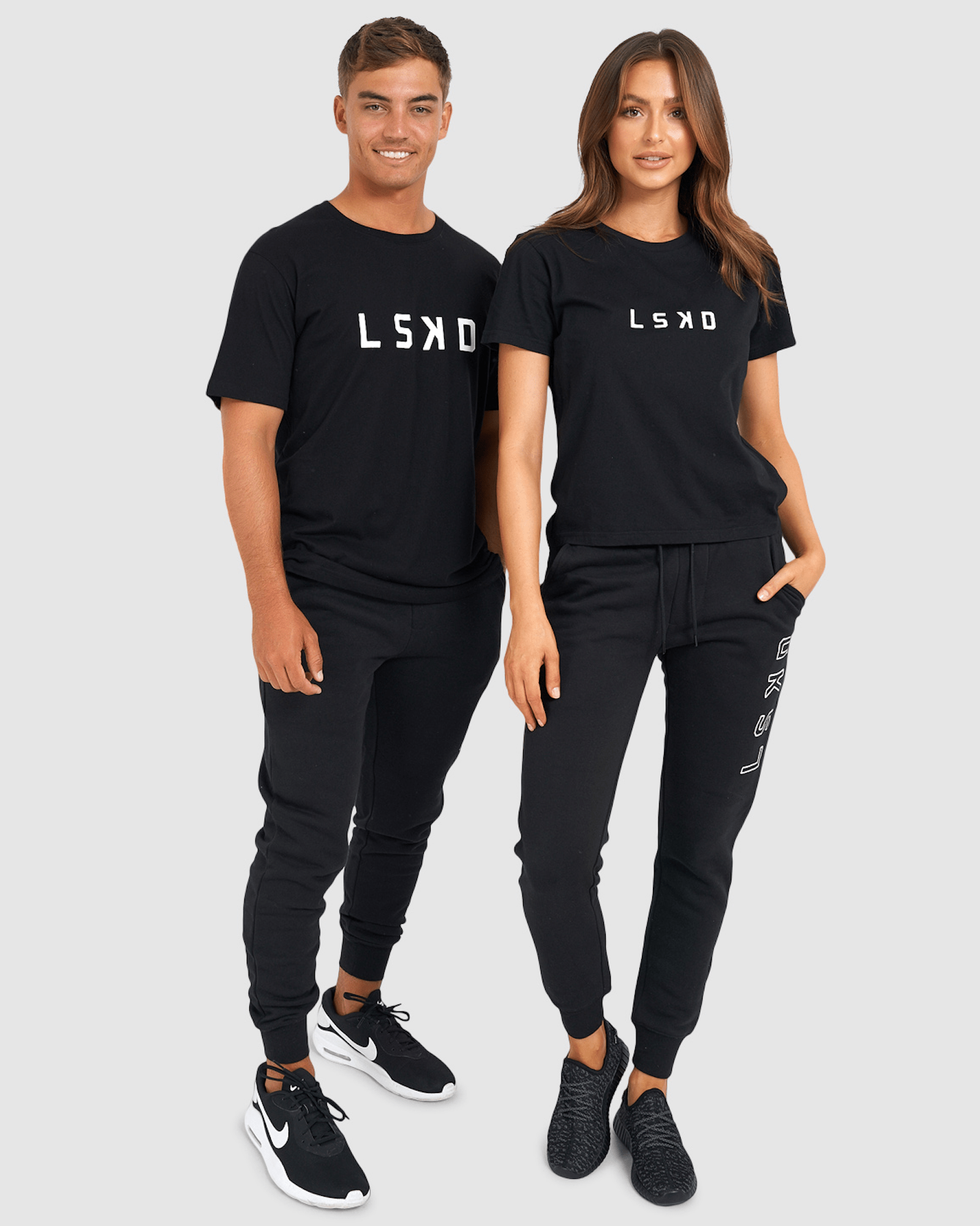 Model wearing Unisex Tidy Trackpant - Black