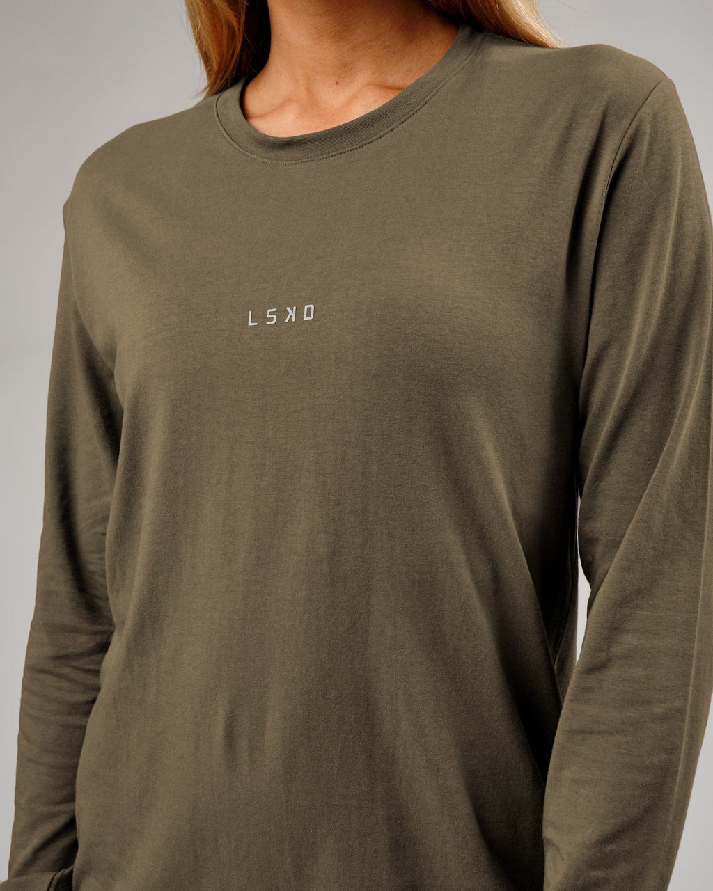 Model wearing Unisex Base LS Tee - Walnut Grey