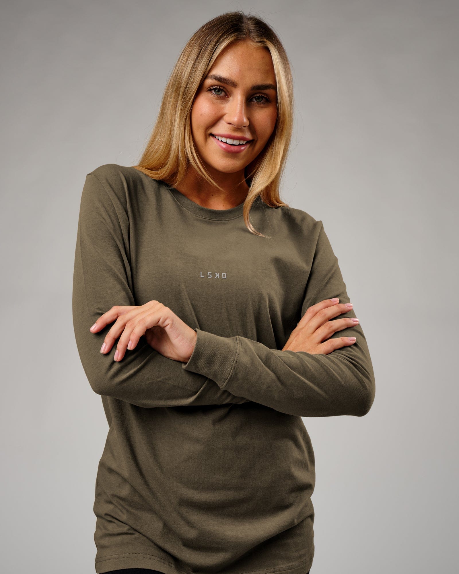 Model wearing Unisex Base LS Tee - Walnut Grey