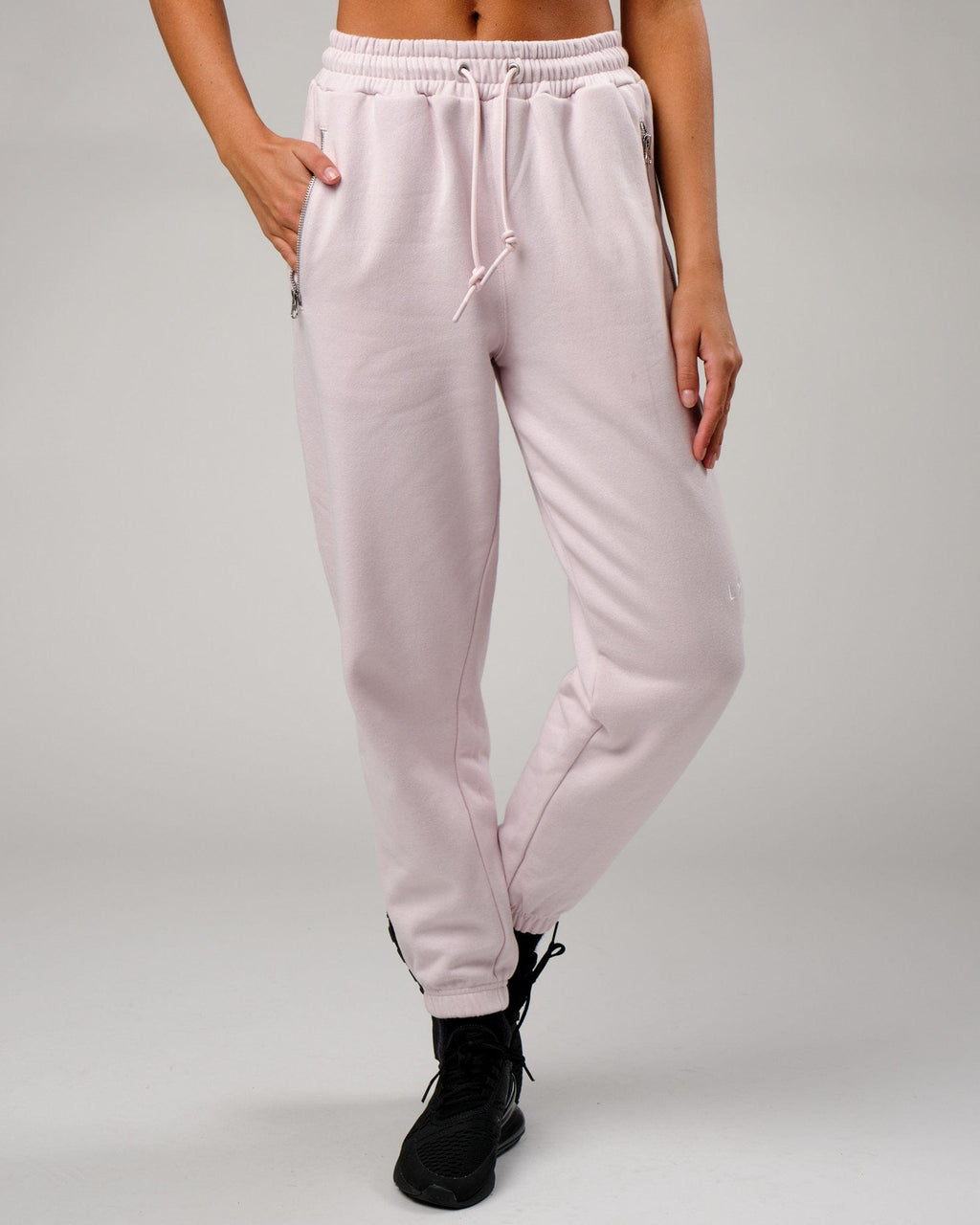 Model wearing Becca Track Pant - Orchid Ice