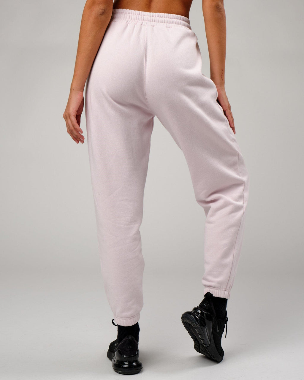 Model wearing Becca Track Pant - Orchid Ice