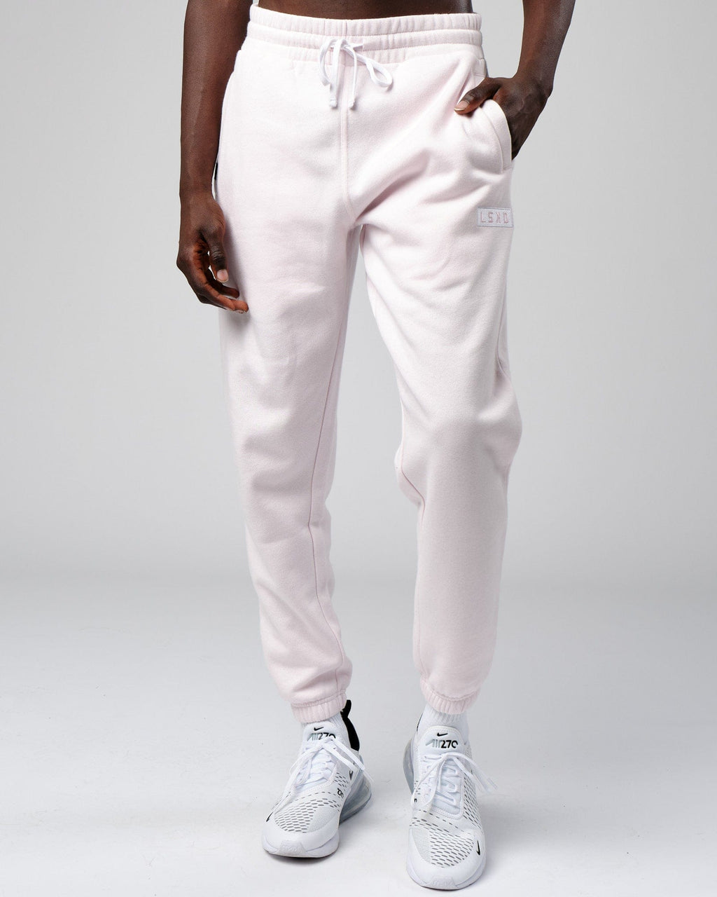 Model wearing Cornerstone Track Pant Oversize - Orchid Ice