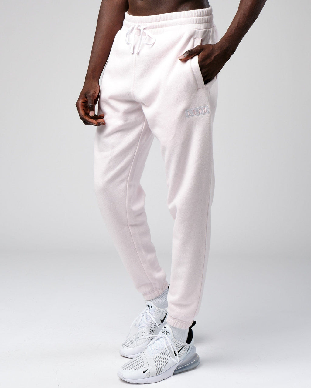 Model wearing Cornerstone Track Pant Oversize - Orchid Ice