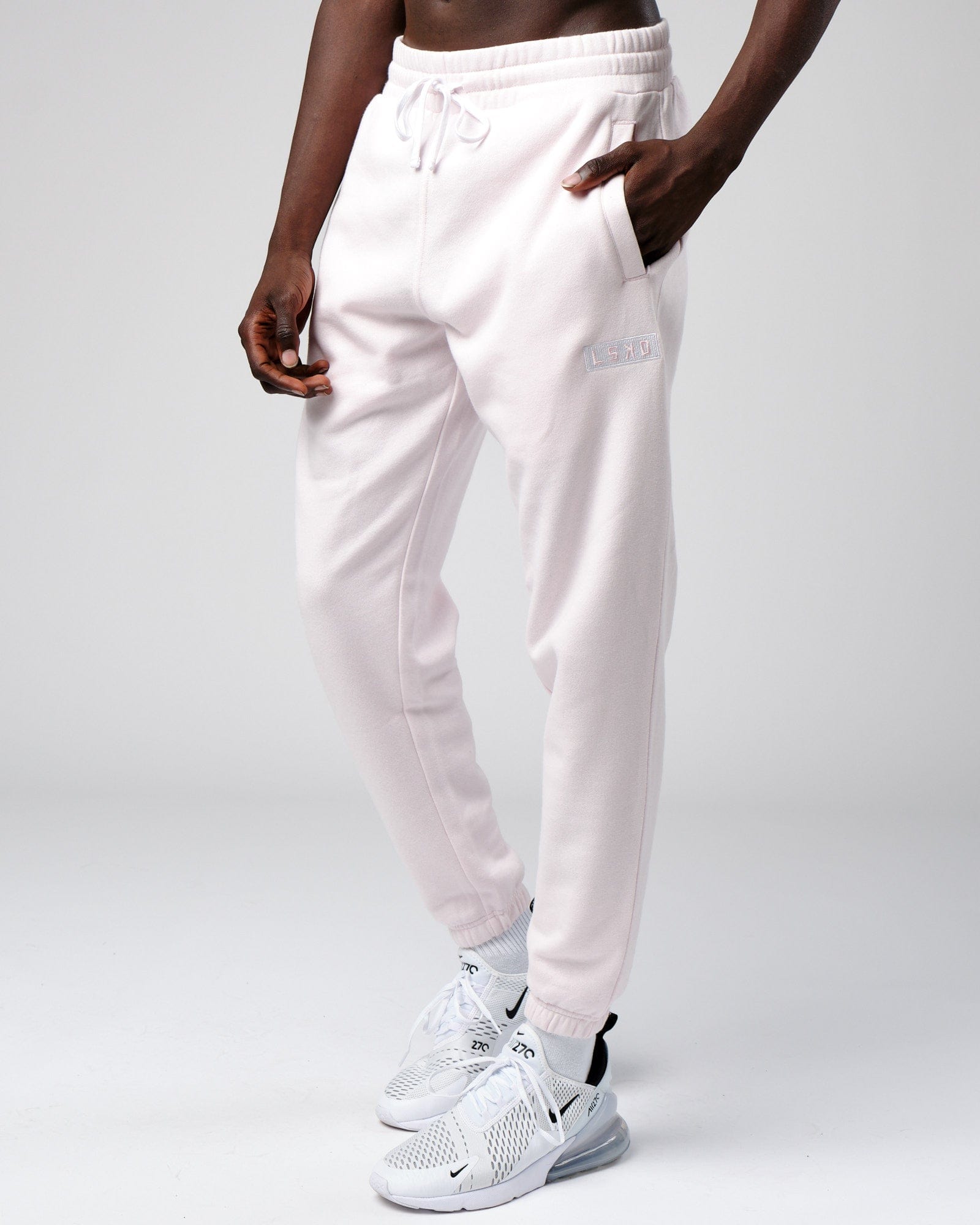 Model wearing Cornerstone Track Pant Oversize - Orchid Ice