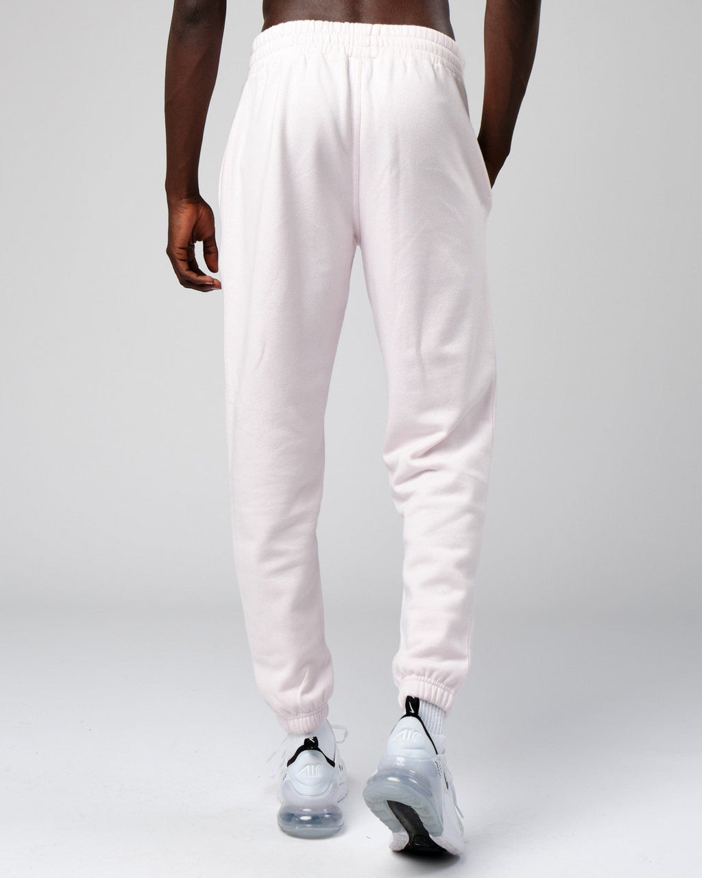 Model wearing Cornerstone Track Pant Oversize - Orchid Ice