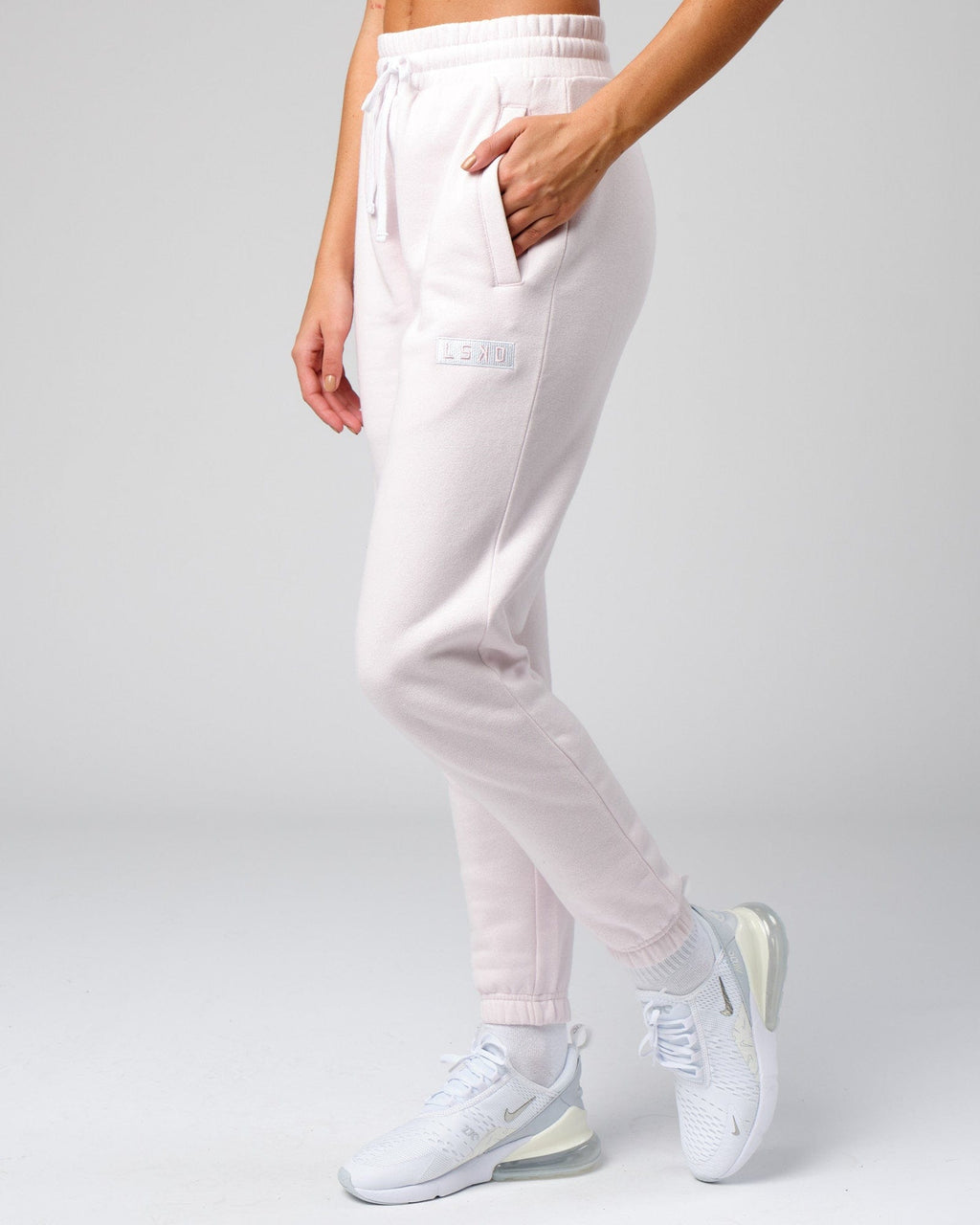 Model wearing Unisex Cornerstone Track Pant Oversize - Orchid Ice
