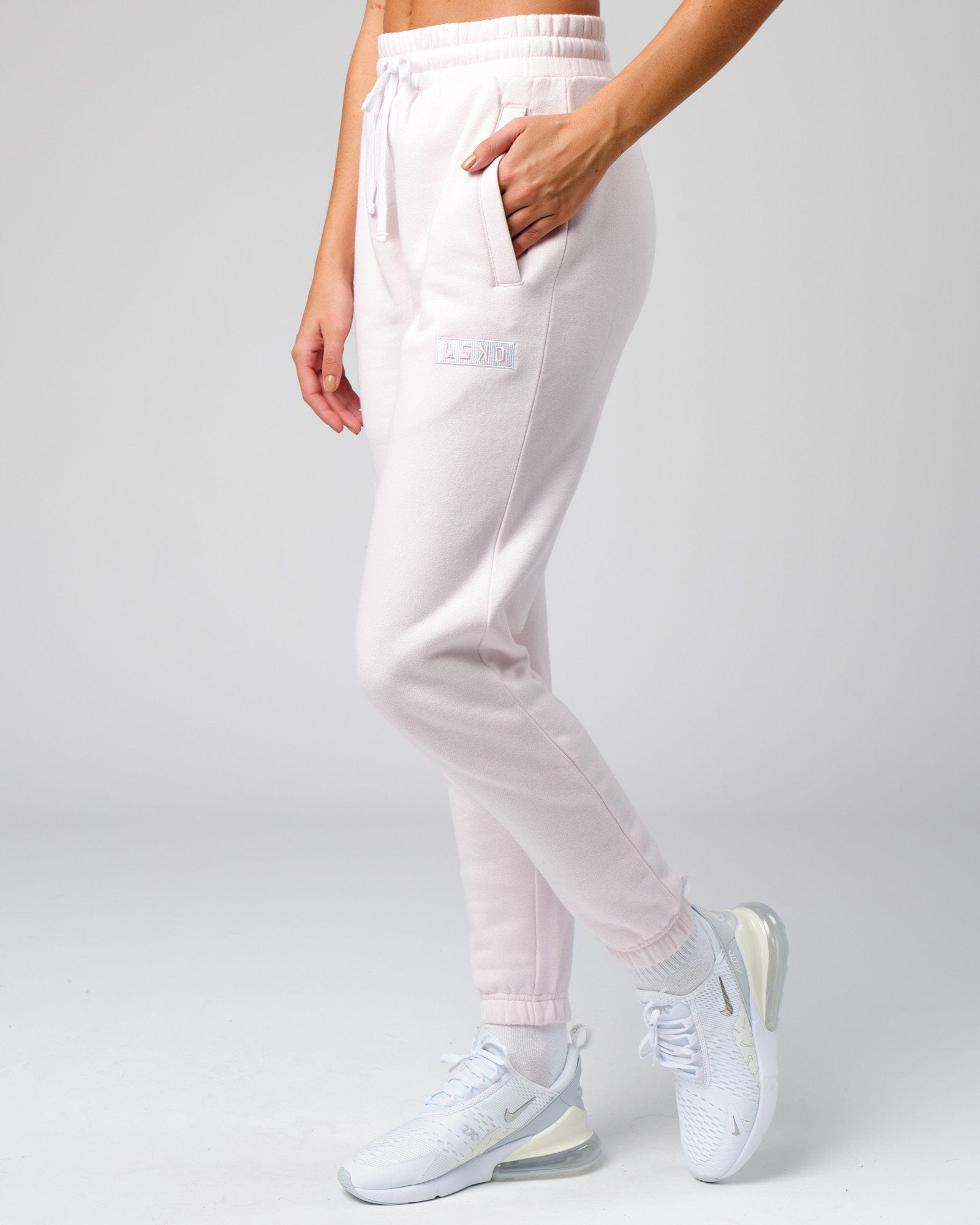 Model wearing Unisex Cornerstone Track Pant Oversize - Orchid Ice
