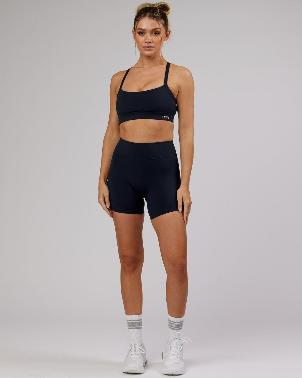 Model wearing RXD Mid Short Tight - Navy