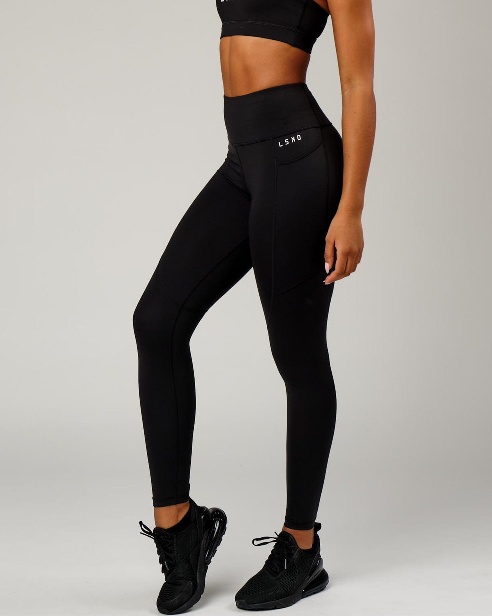 Model wearing Rep Full Length Tight Small Logo - Black-White