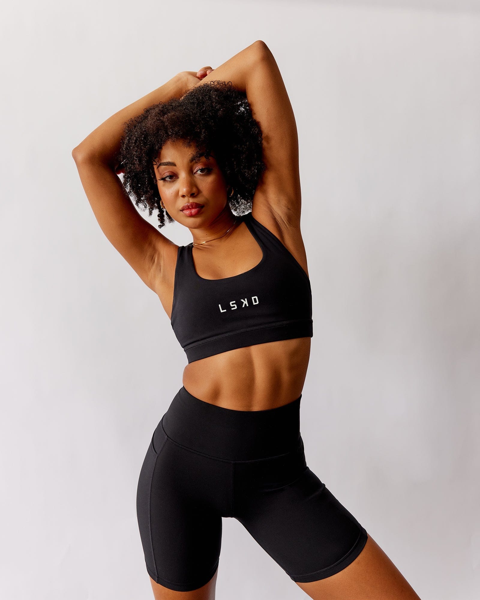 Model wearing Rep Sports Bra Small Logo - Black-White