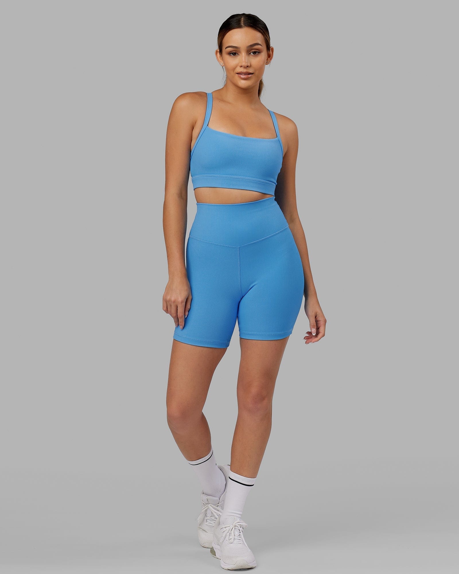 Model wearing Strike Ribbed Mid Short Tights - Azure Blue