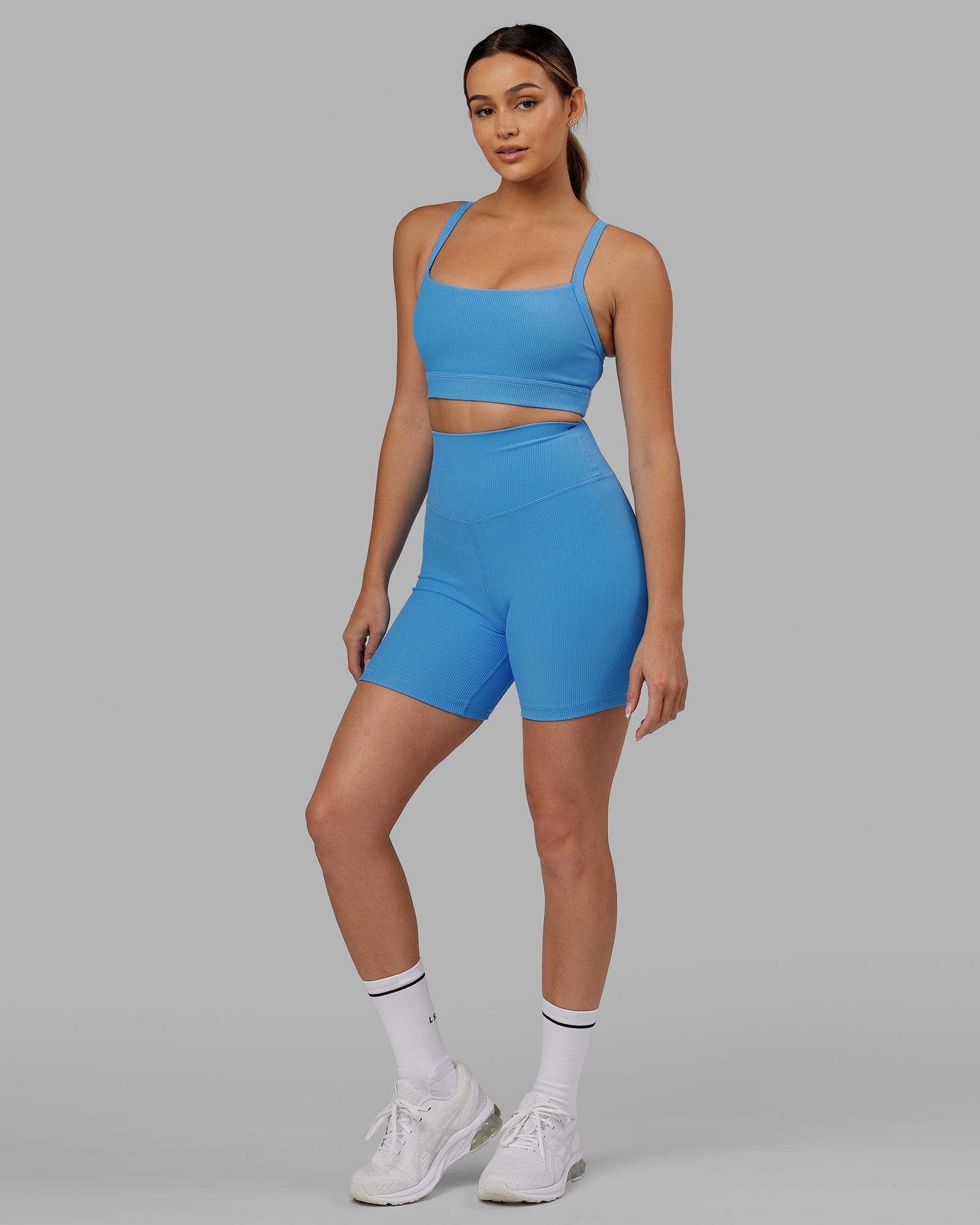 Model wearing Strike Ribbed Mid Short Tights - Azure Blue