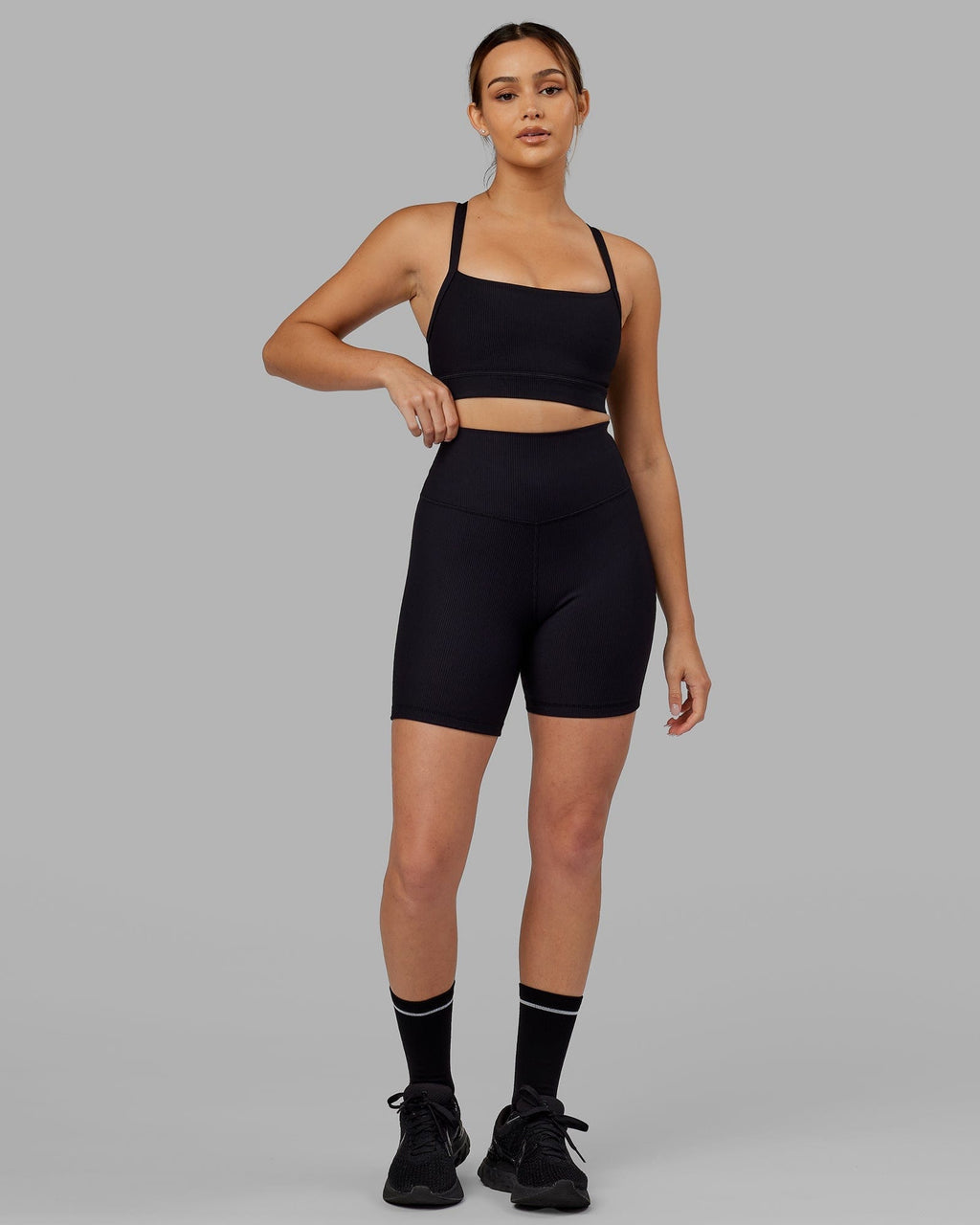 Model wearing Strike Ribbed Mid Short Tights - Black