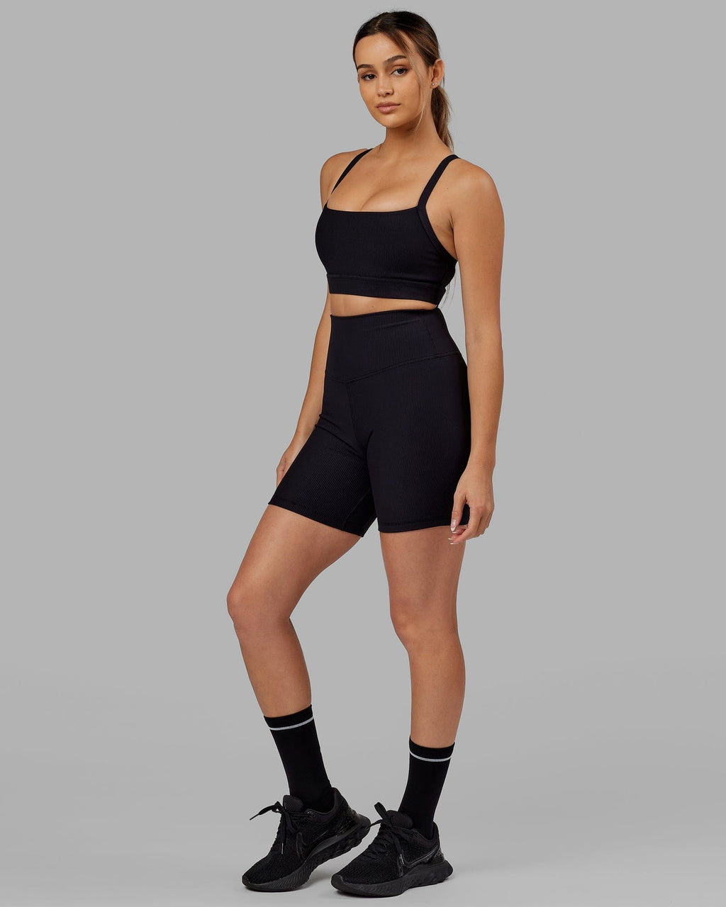 Model wearing Strike Ribbed Mid Short Tights - Black