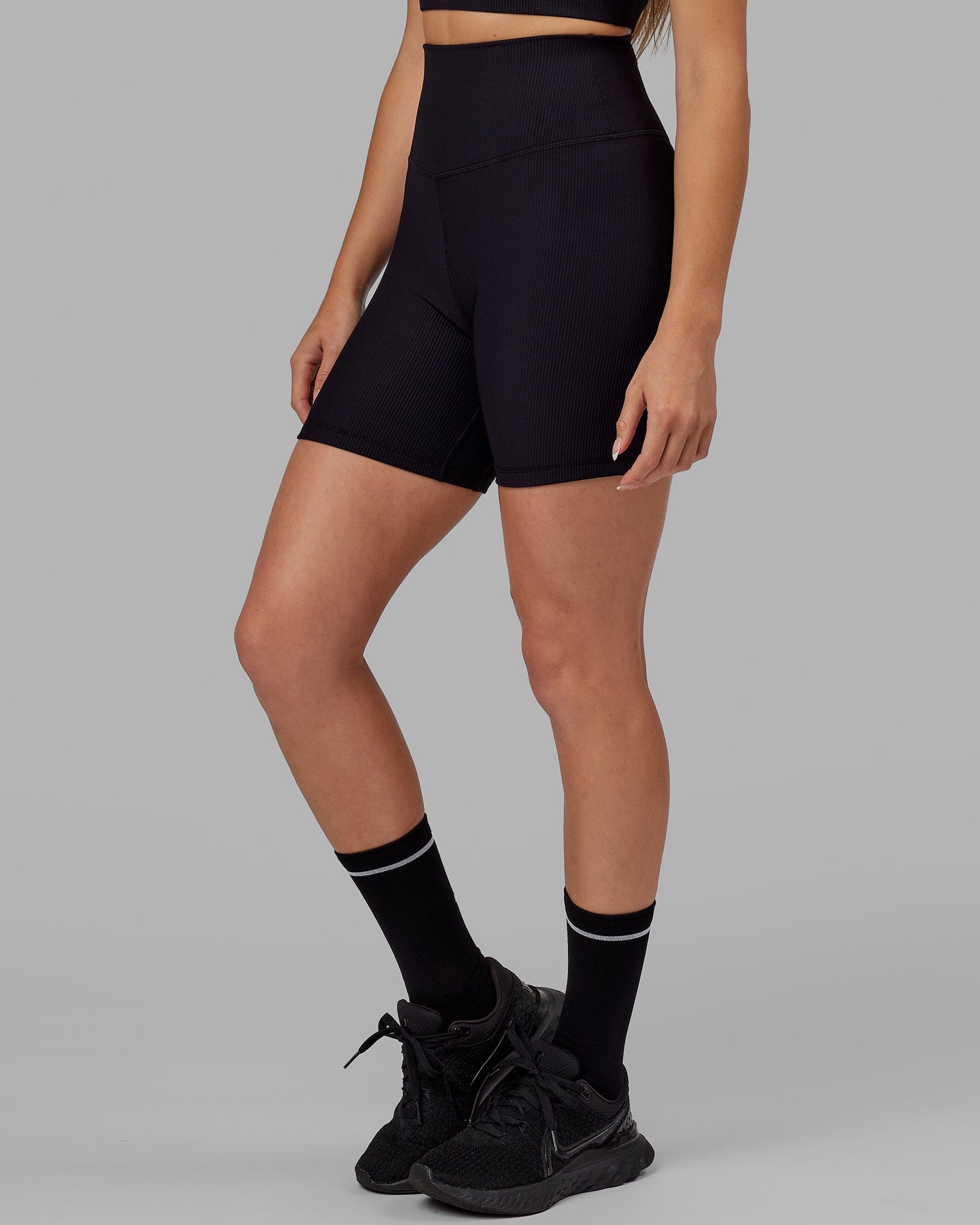 Model wearing Strike Ribbed Mid Short Tights - Black