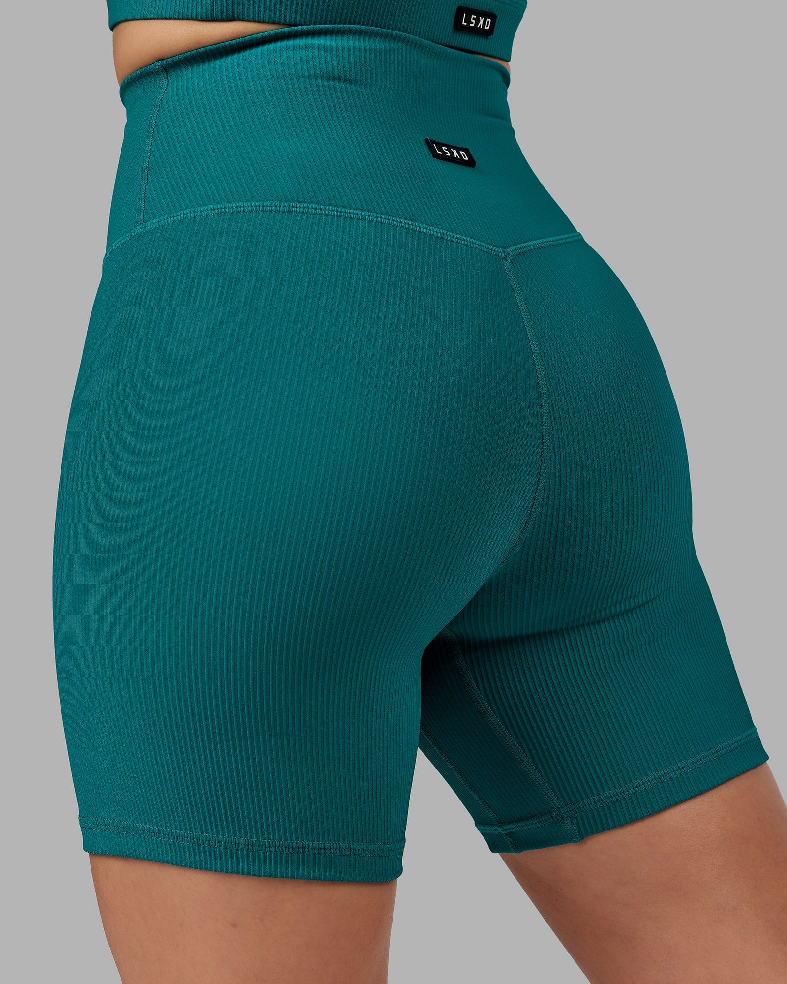 Model wearing Strike Ribbed Mid Short Tights - Sea Green