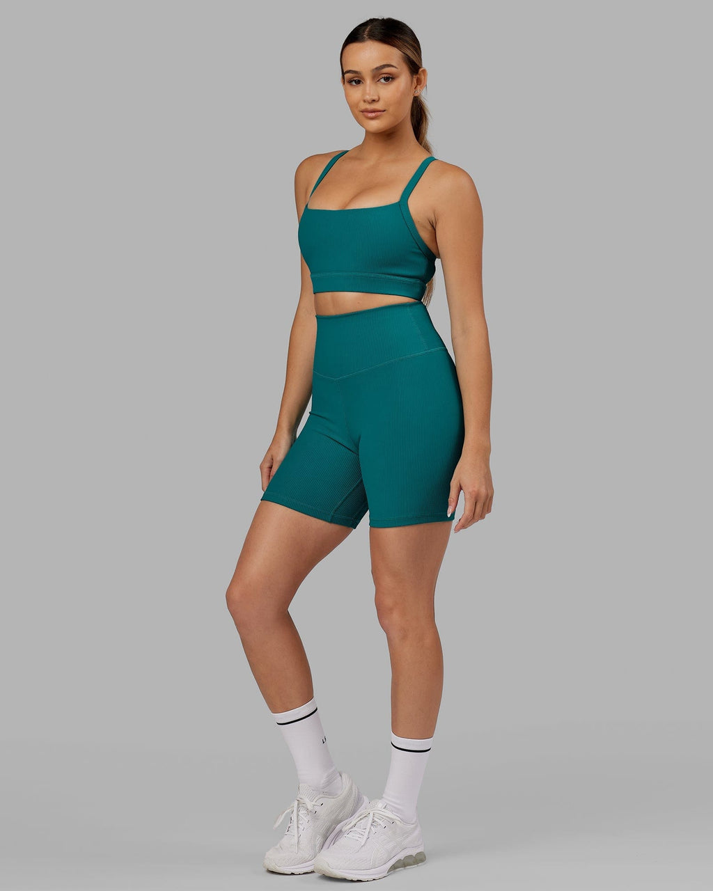 Model wearing Strike Ribbed Mid Short Tights - Sea Green