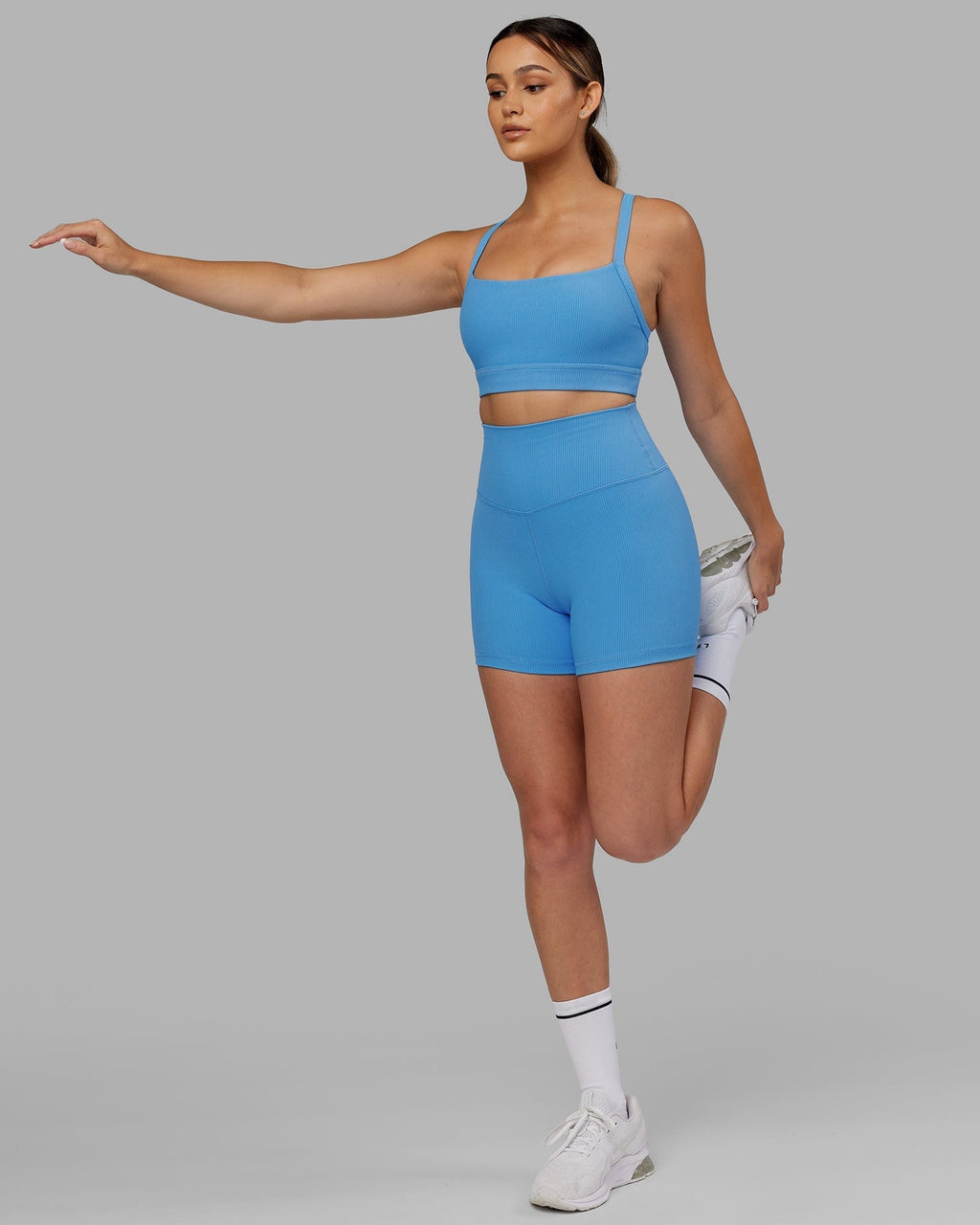 Model wearing Strike Ribbed X Short Tights - Azure Blue