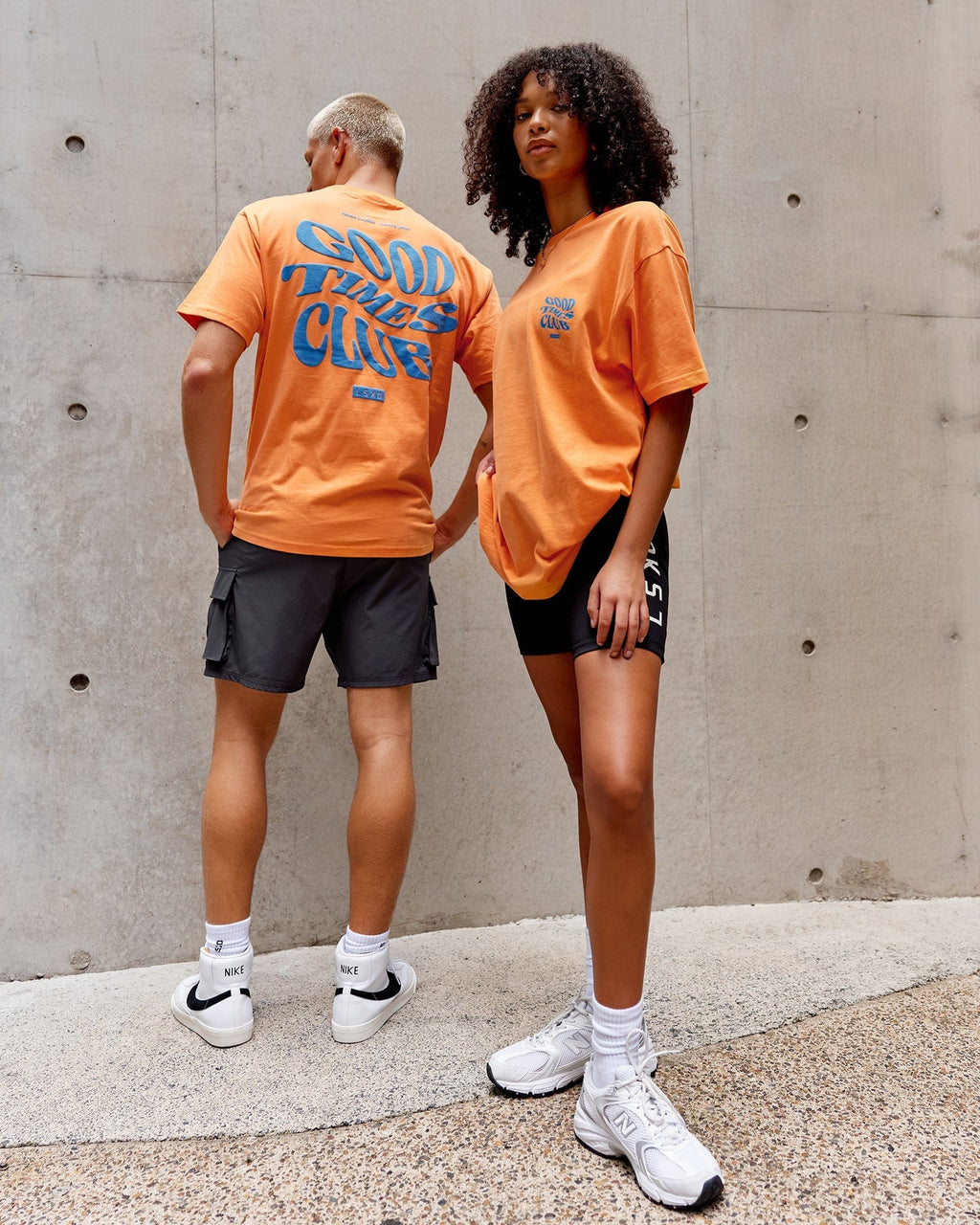 Model wearing Unisex Good Times Heavyweight Tee Oversize - Tangerine-Blue