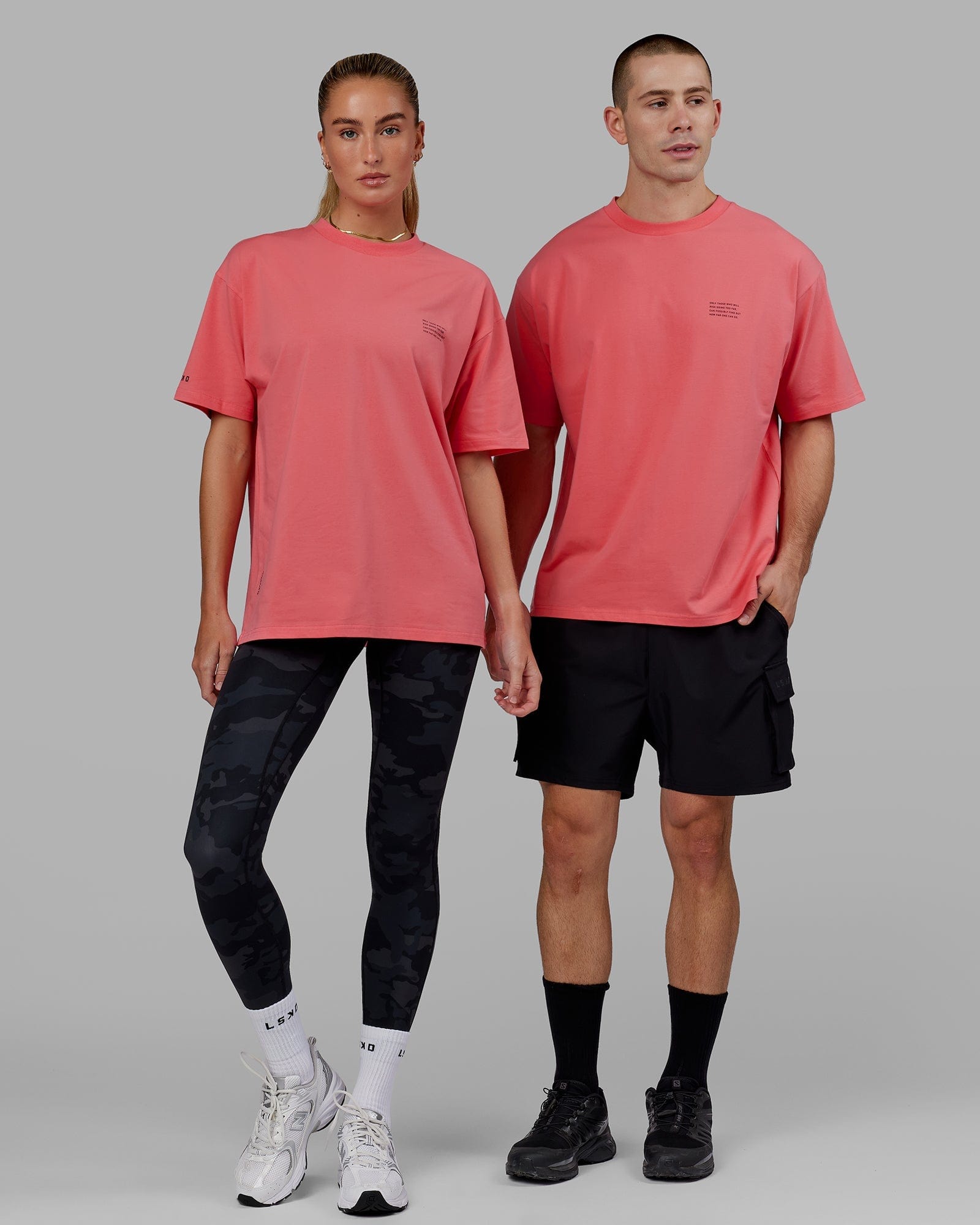 Model wearing Unisex Strive FLXCotton Tee Oversize - Sunkist Coral