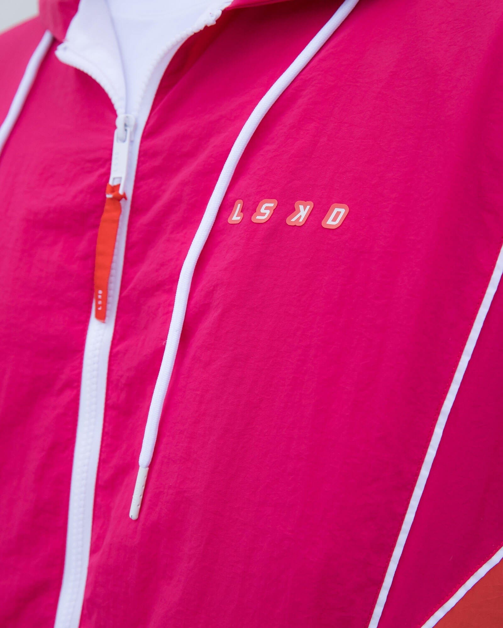 Model wearing Unisex Peak Zip Through Track Jacket Oversize - Boysenberry