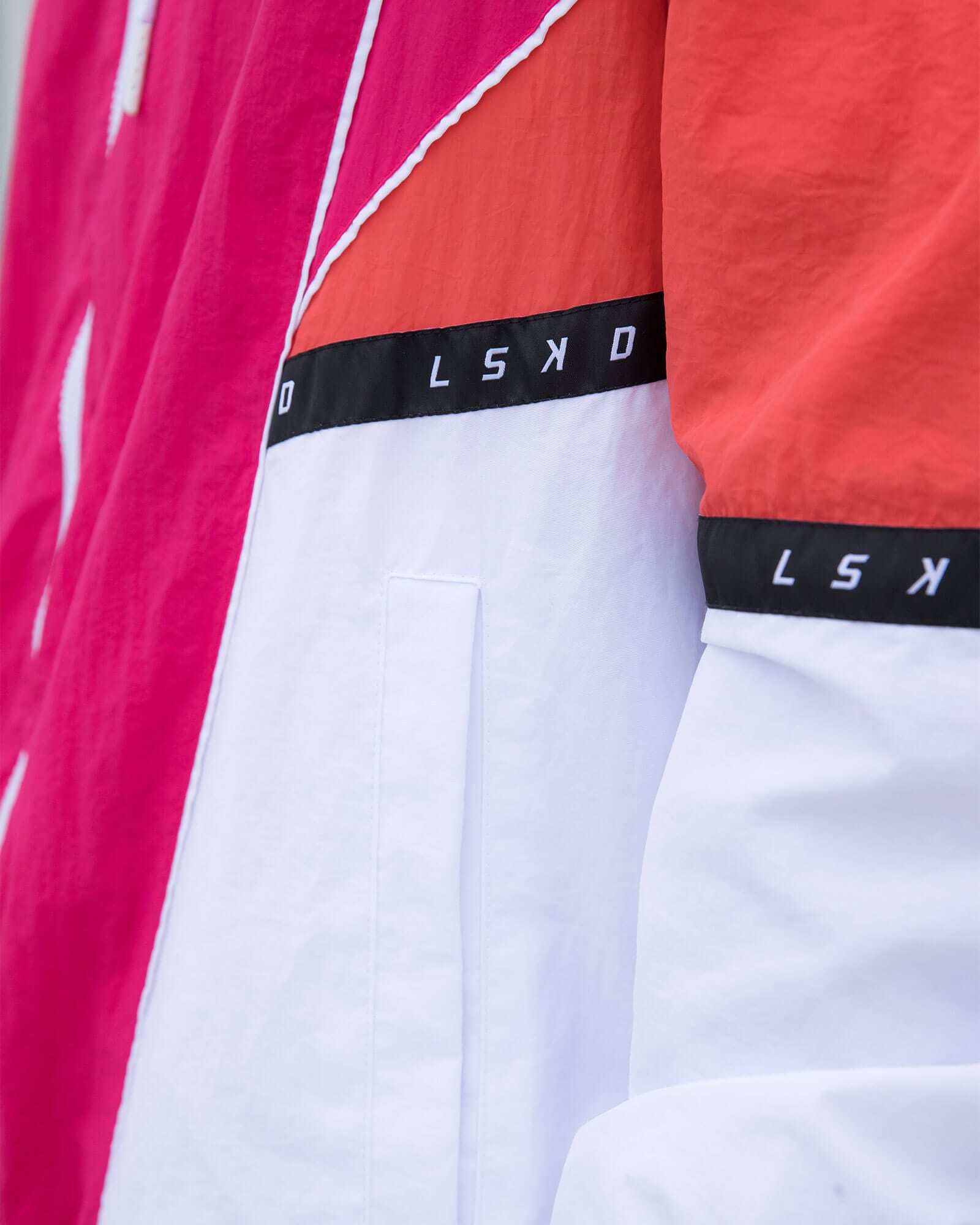 Model wearing Unisex Peak Zip Through Track Jacket Oversize - Boysenberry