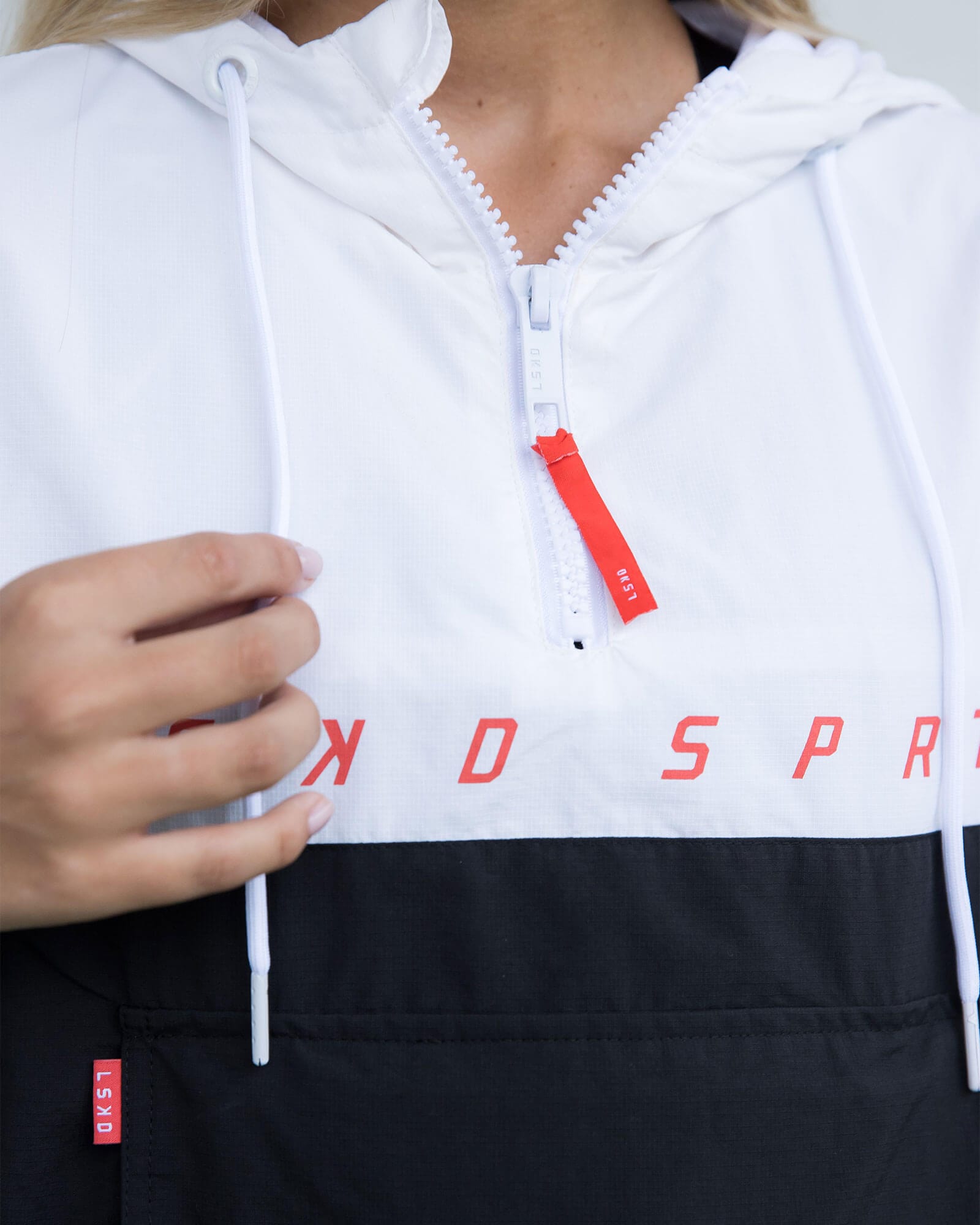 Model wearing Unisex Speedster Packable Track Jacket Oversize - Black-White