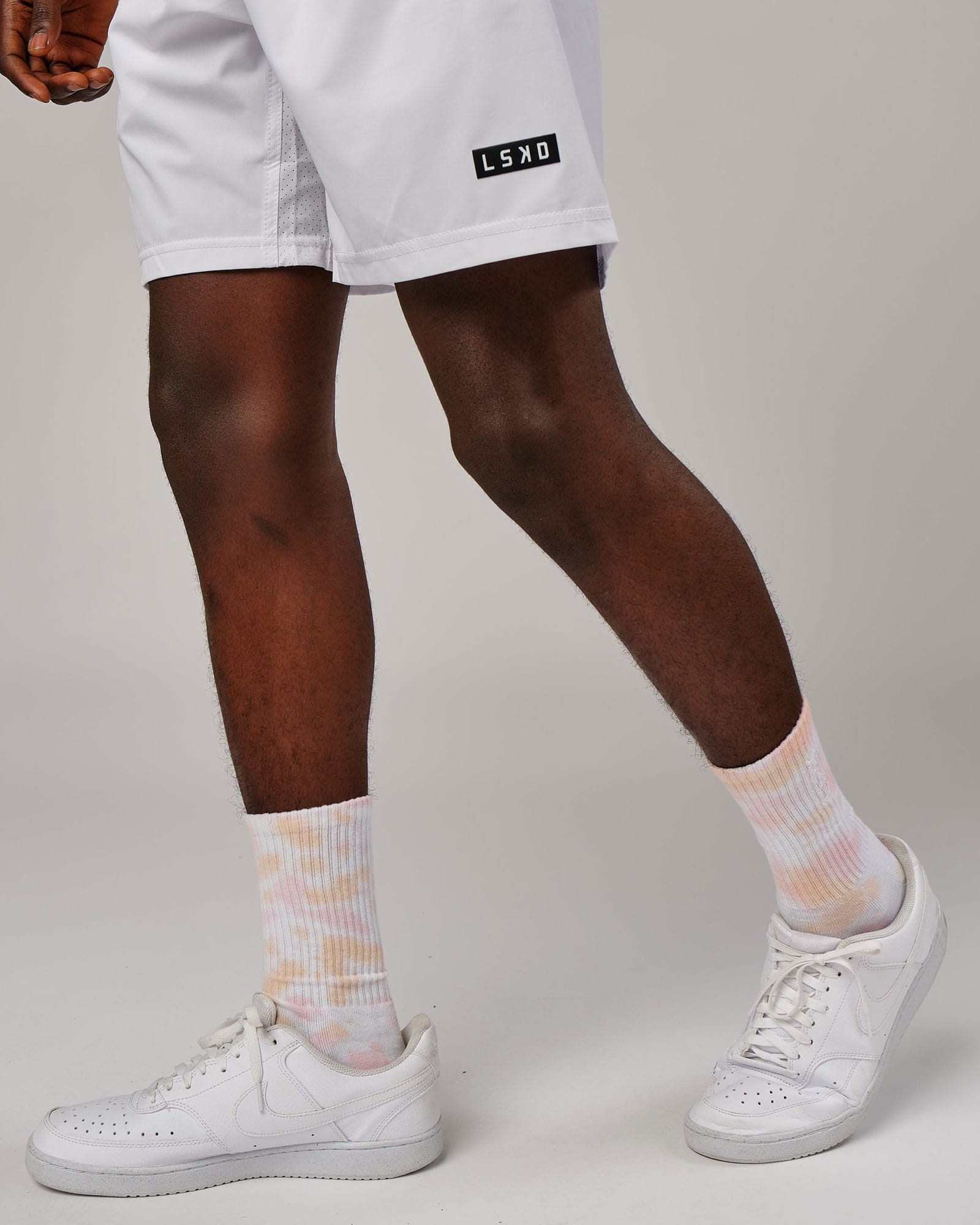 Model wearing Signal Crew Sock - Tutti Frutti Tie Dye