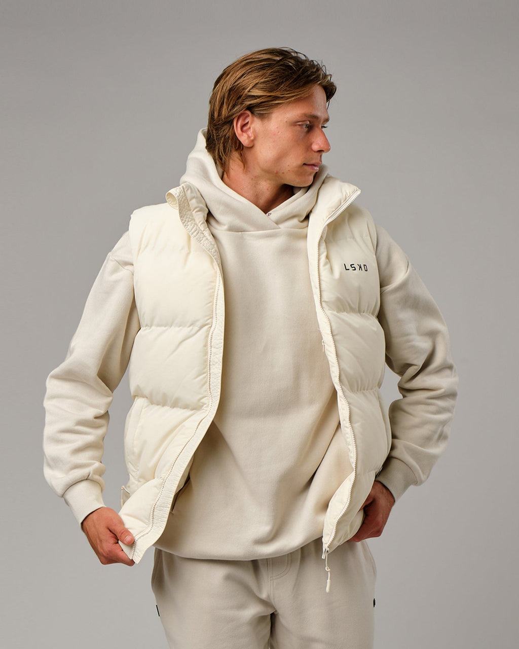 Model wearing Essential Puffer Vest - Cream