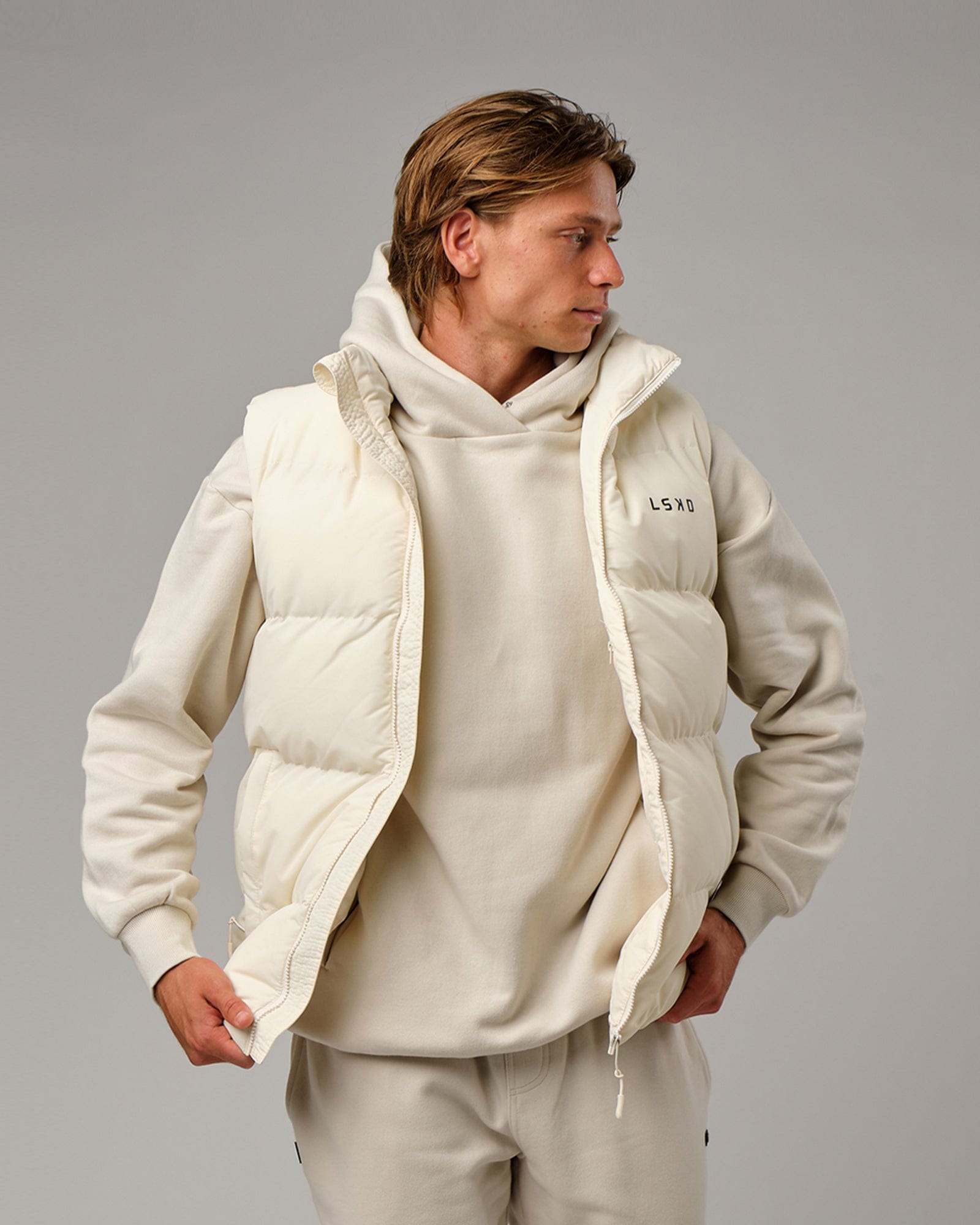 Model wearing Essential Puffer Vest - Cream