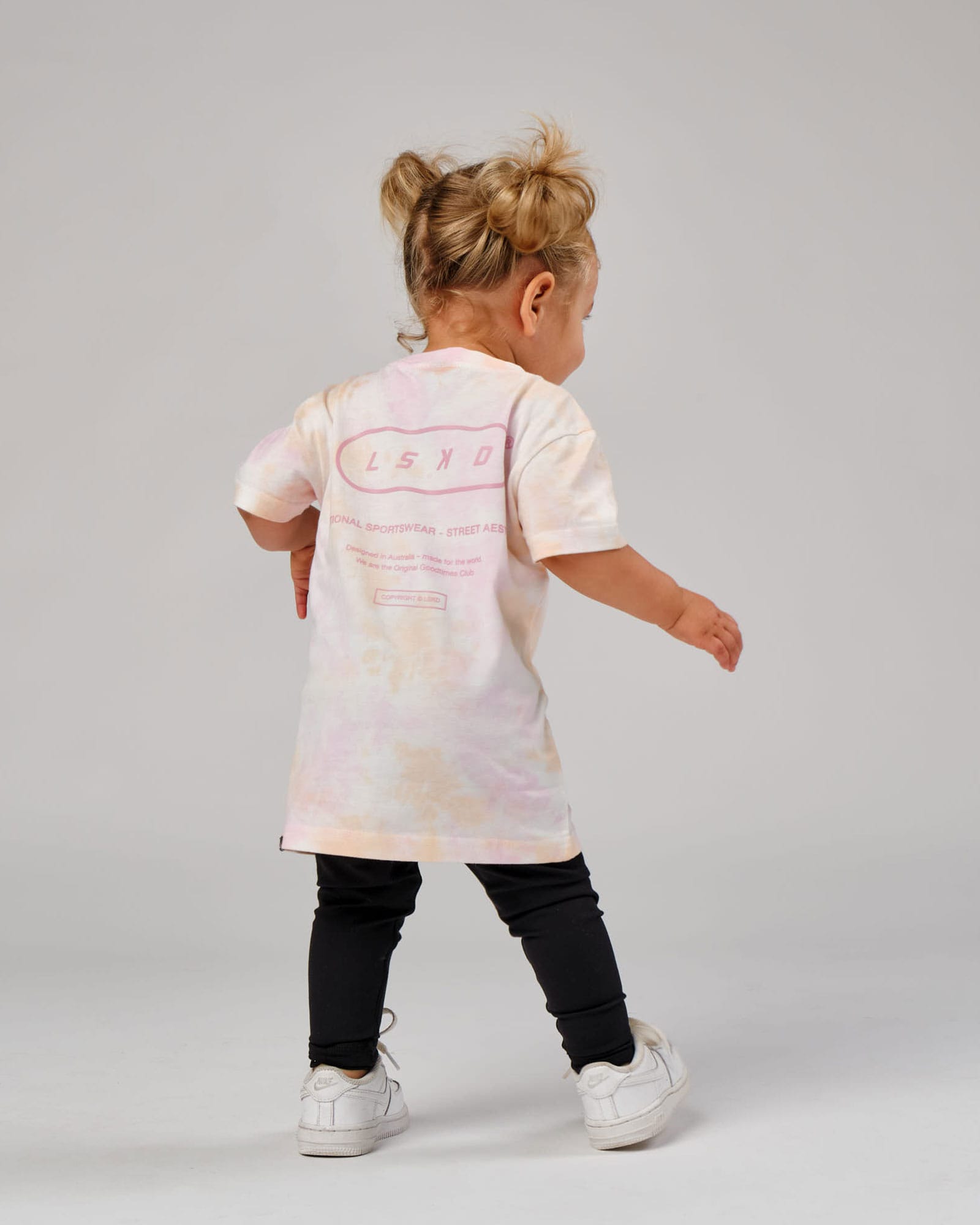 Model wearing CTA Tee (00-8) - Tutti Frutti Tie Dye