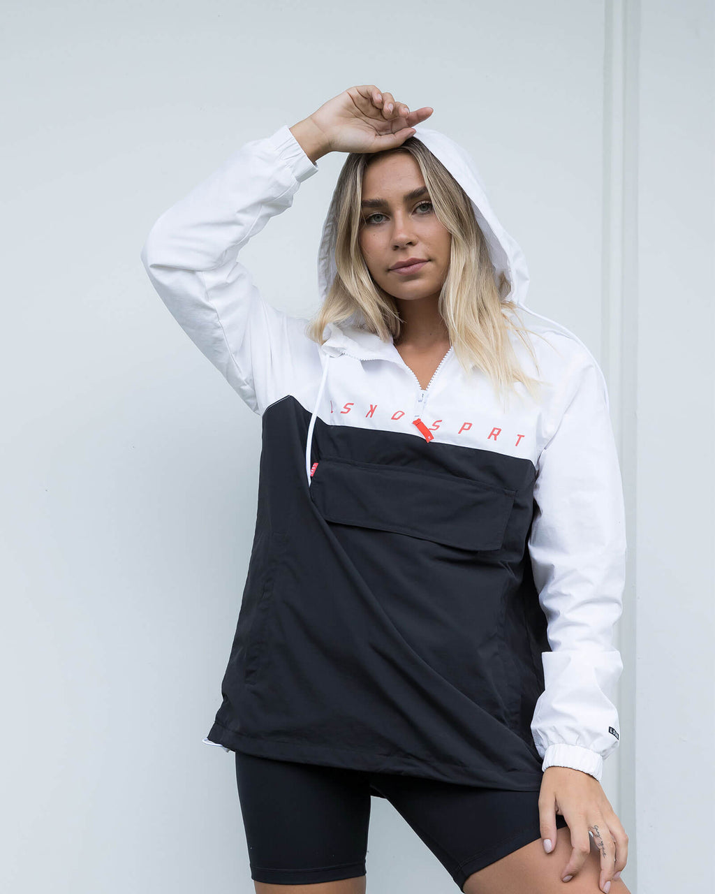 Model wearing Unisex Speedster Packable Track Jacket Oversize - Black-White