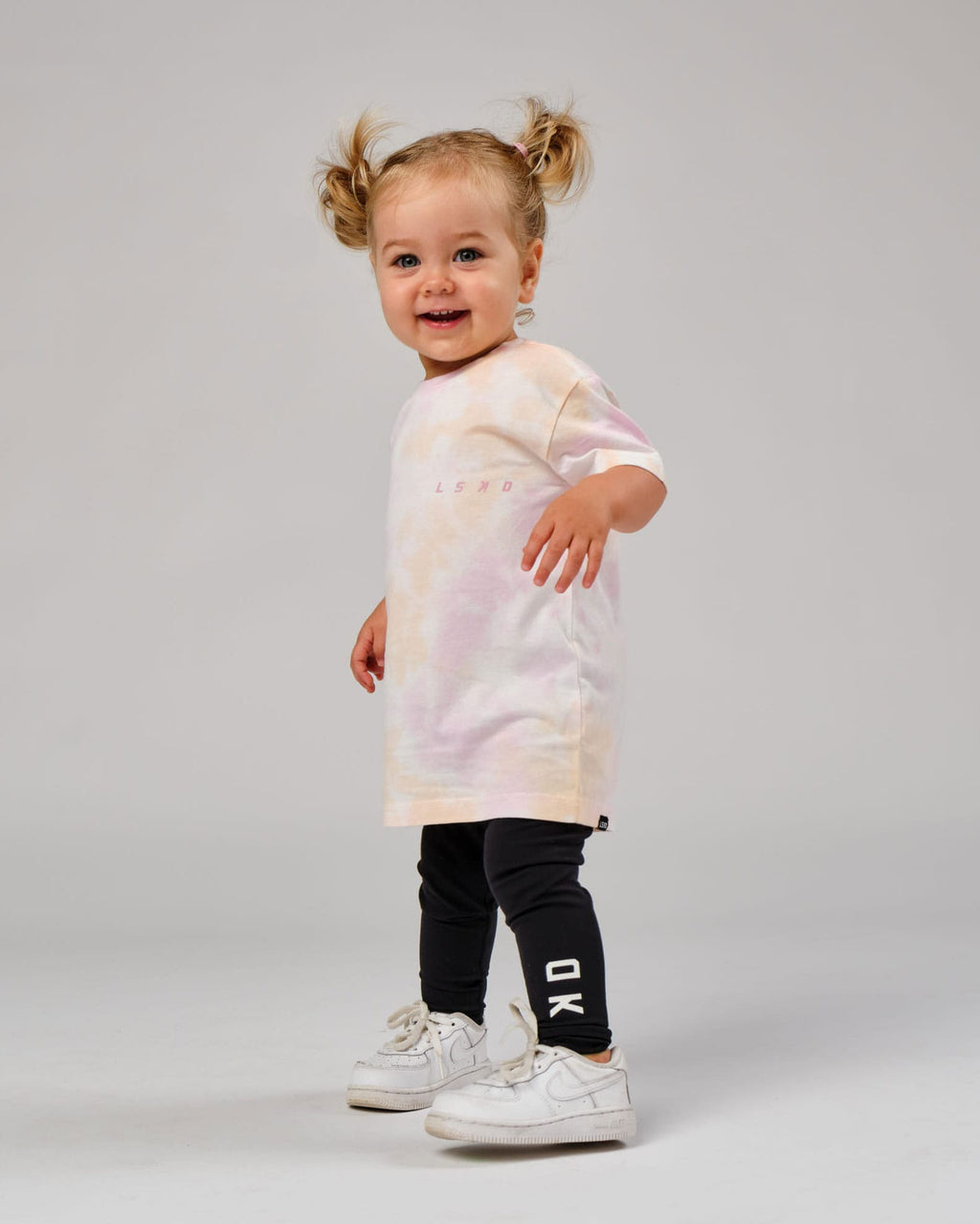 Model wearing CTA Tee (00-8) - Tutti Frutti Tie Dye