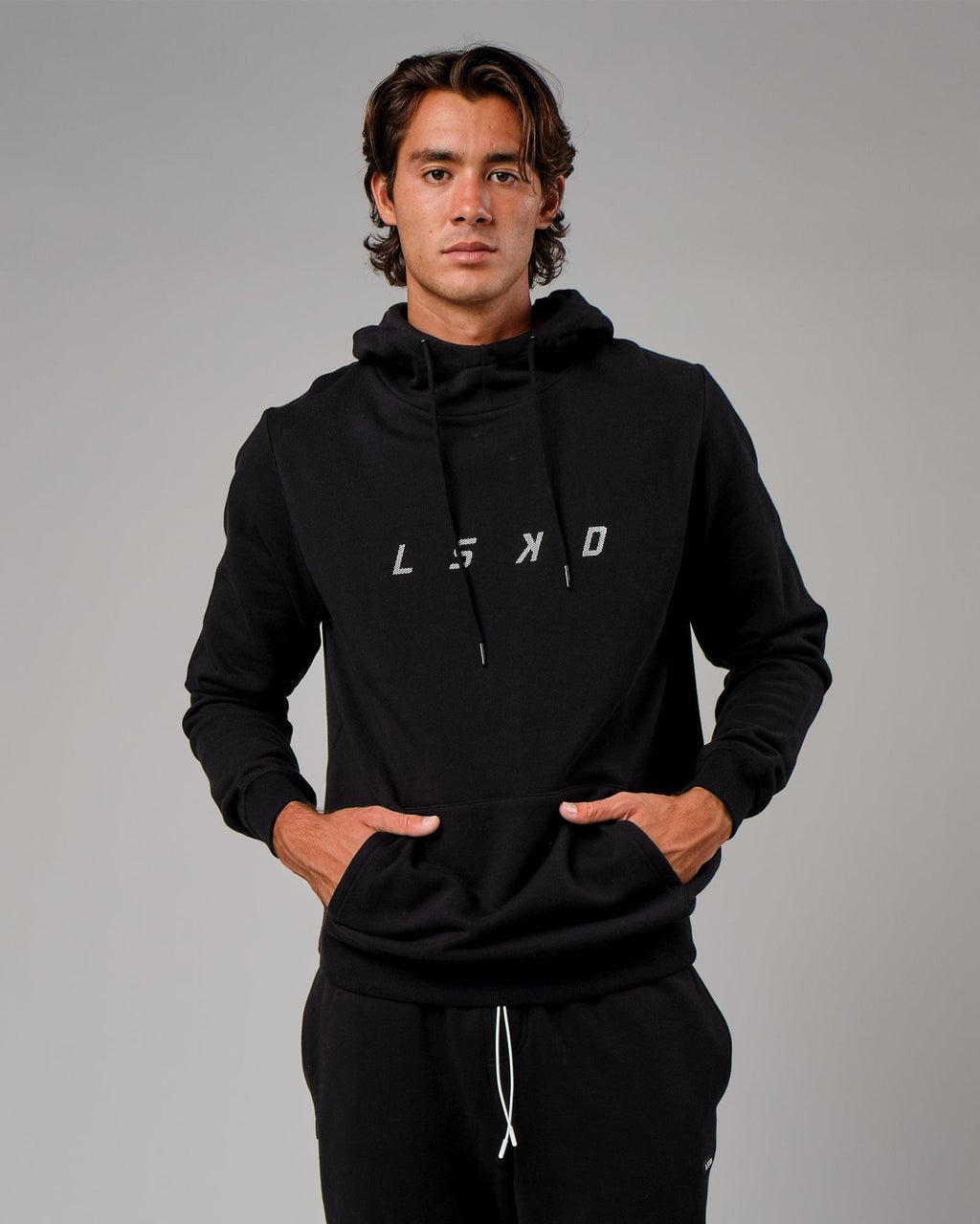 Model wearing Grid Hoodie - Black