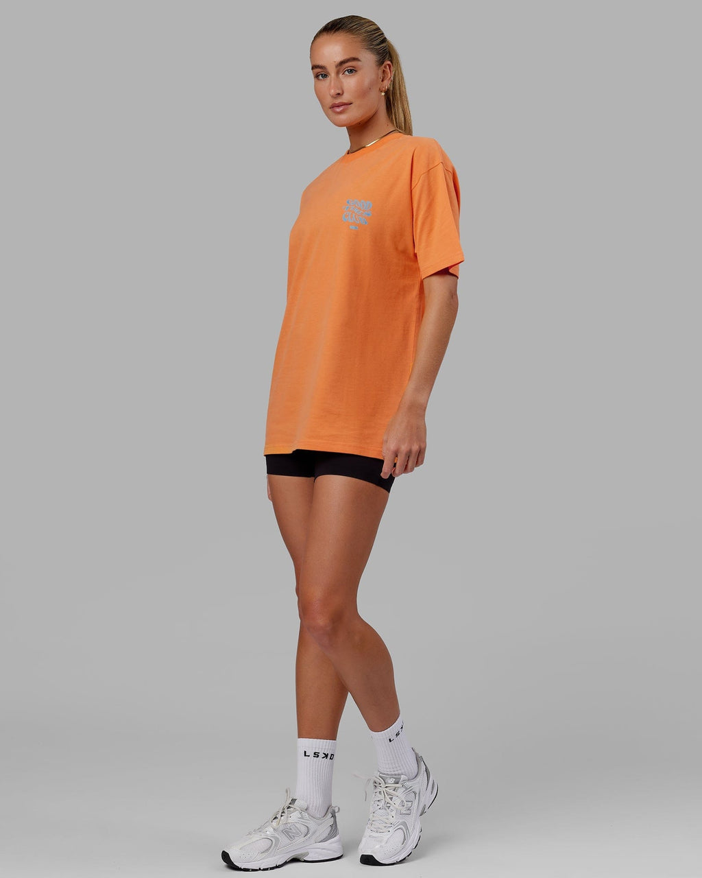 Model wearing Unisex Good Times Heavyweight Tee Oversize - Tangerine-Blue